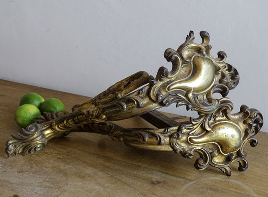 Ornate French antique gilt bronze curtain rod brackets with scrollwork 