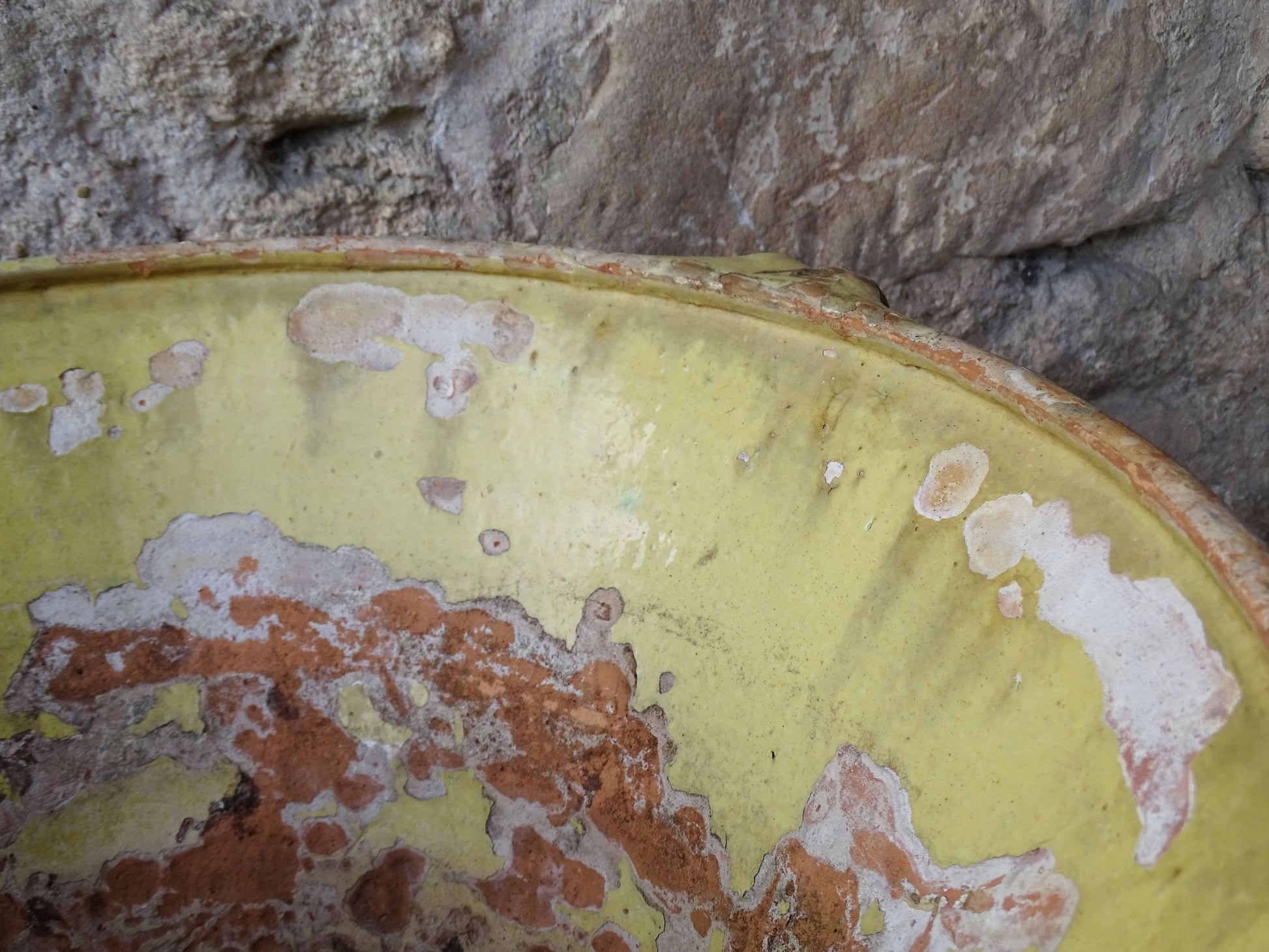 French antique tian bowl with a yellow glazed interior. Old terracotta confit bowl from the 19th century.