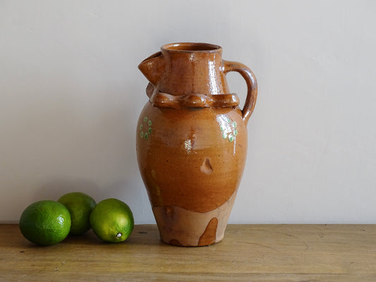 French antique terracotta pitcher from Savoie with orange glaze and yellow dots. Savoyard pottery jug with applied detailing. 