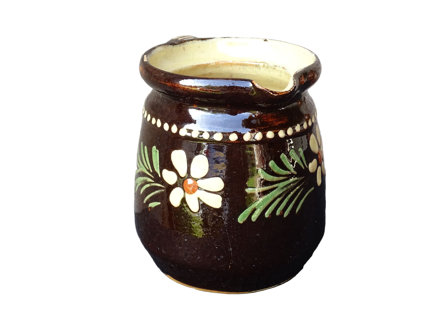 French vintage ceramic pitcher from Alsace. Pottery jug with brown glaze and hand painted with flowers, leaves and dots.