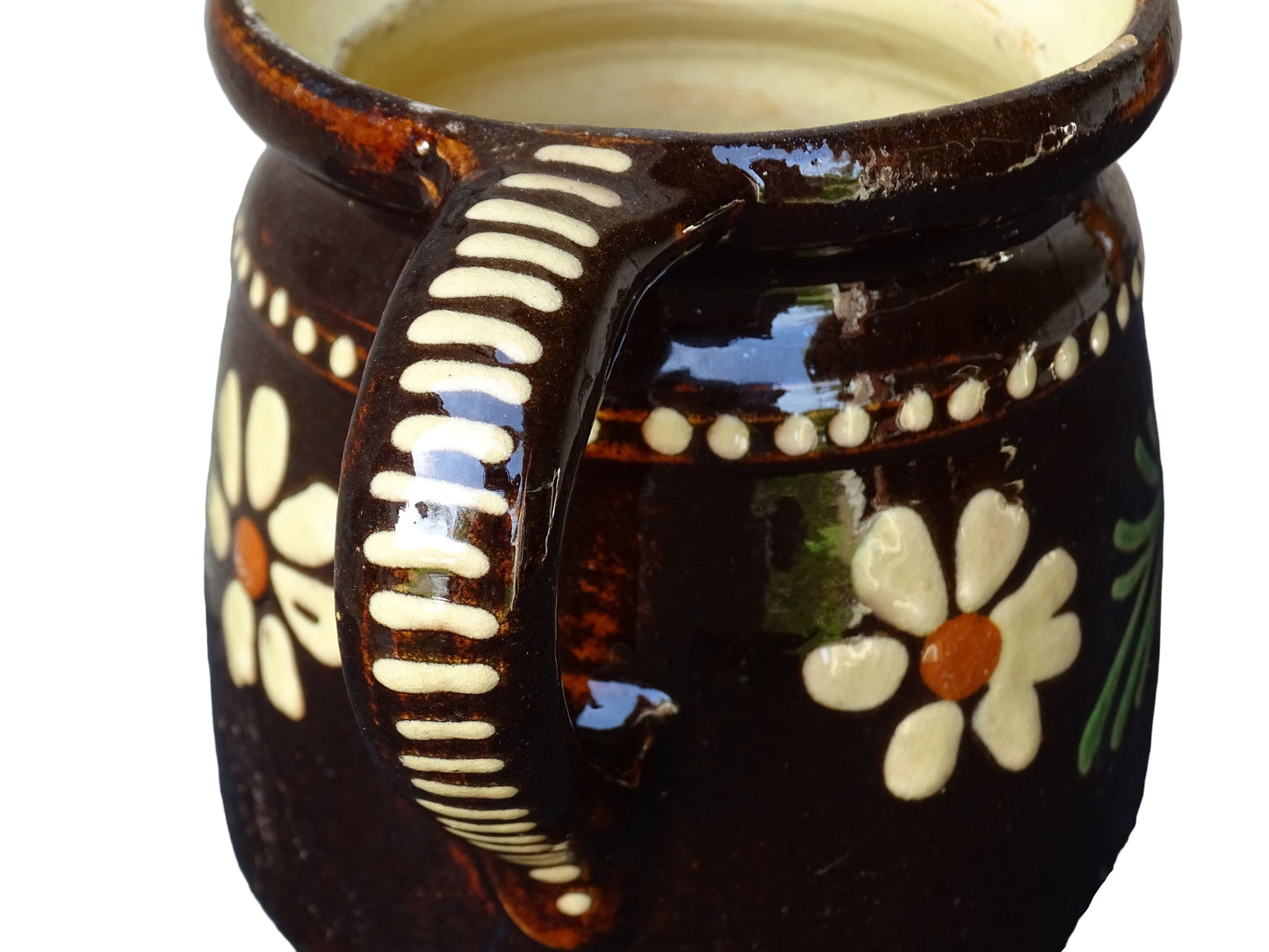 French vintage ceramic pitcher from Alsace. Pottery jug with brown glaze and hand painted with flowers, leaves and dots.