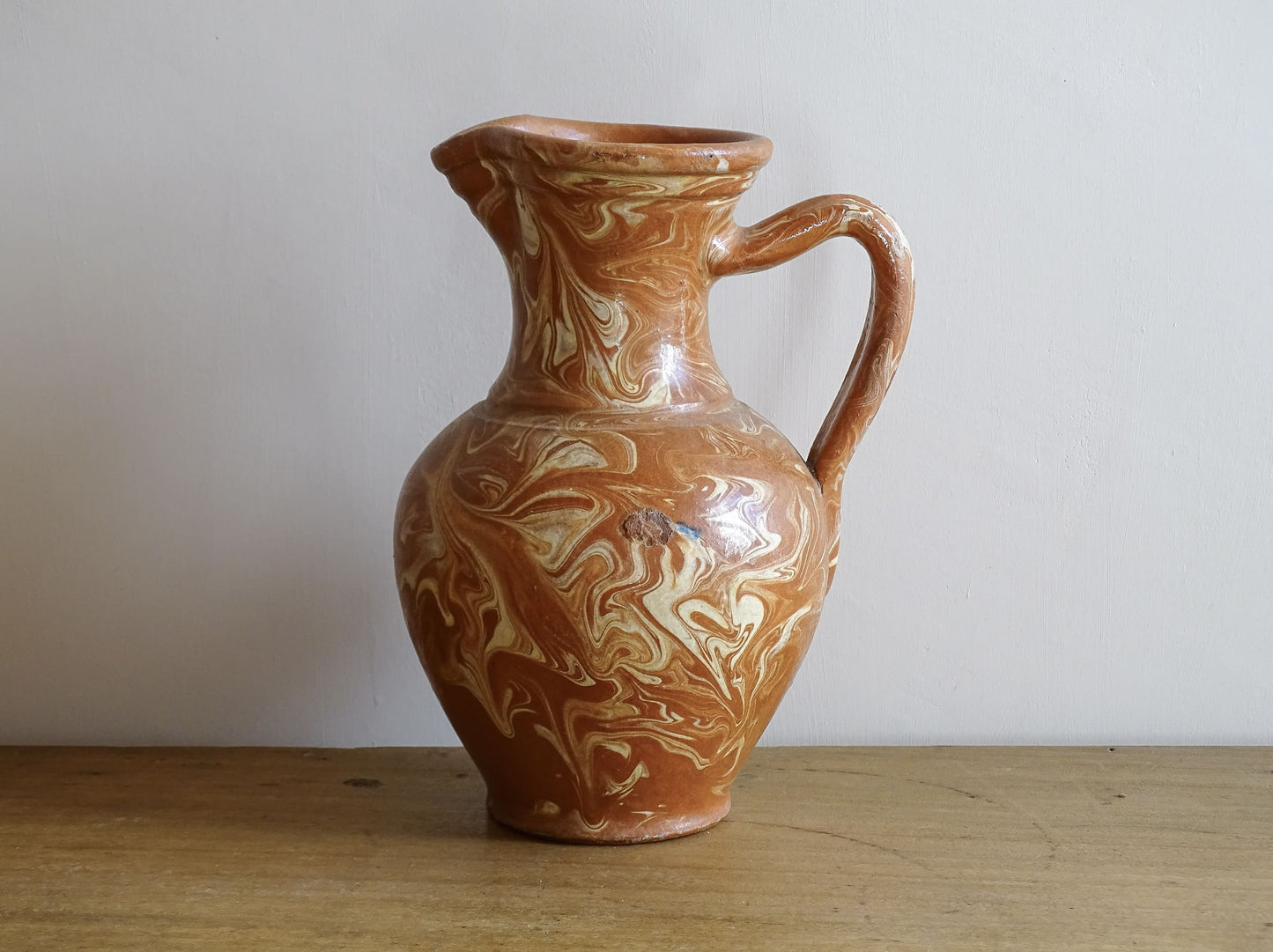 French vintage terracotta pitcher with a marbled glaze. Jaspe glaze ceramic jug.