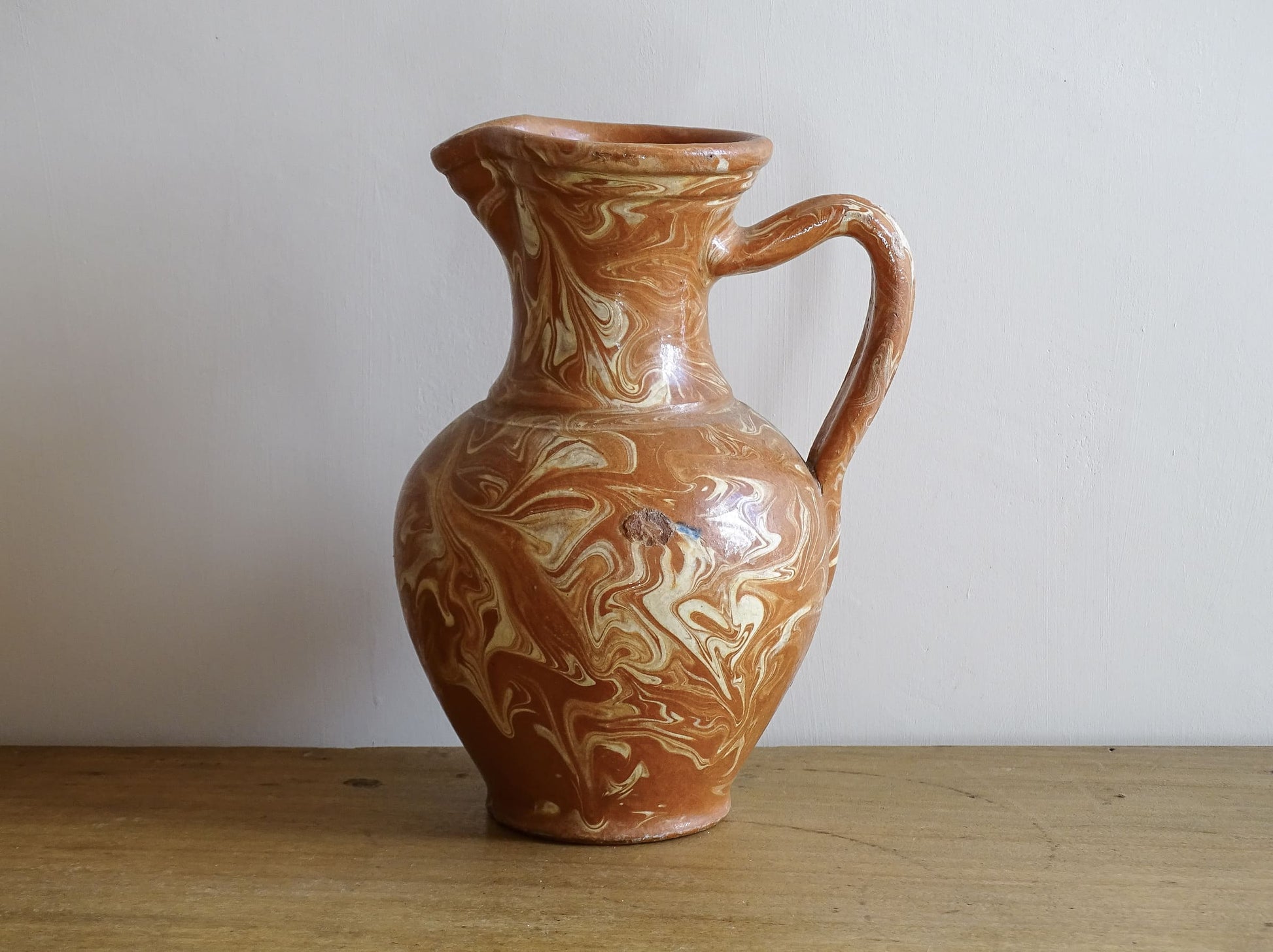 French vintage terracotta pitcher with a marbled glaze. Jaspe glaze ceramic jug.