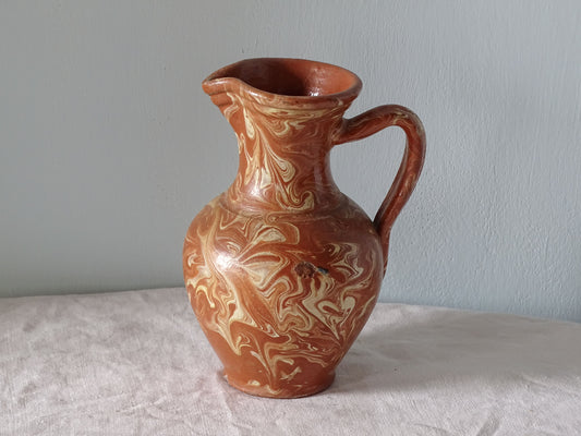 French vintage earthenware pitcher with orange marble glaze 