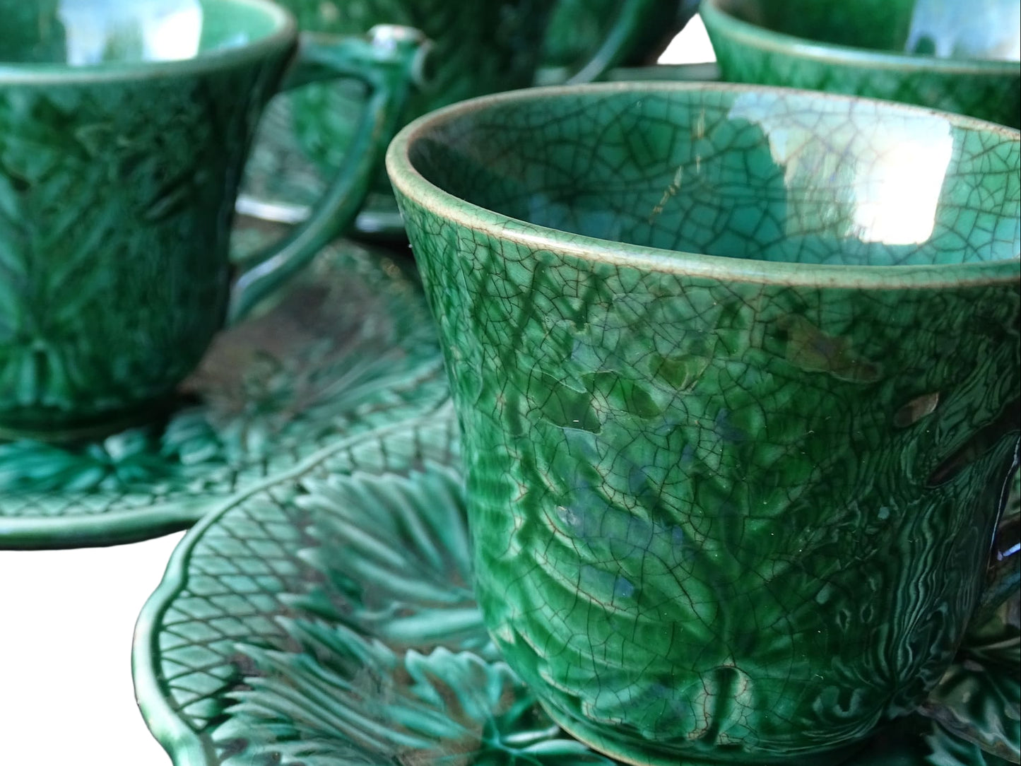 Set of 10 vintage coffee cups by Gien in the Primefleur design with leaf patterns. Green glazed ceramic cups and saucers. Barbotine or majolica cups. 