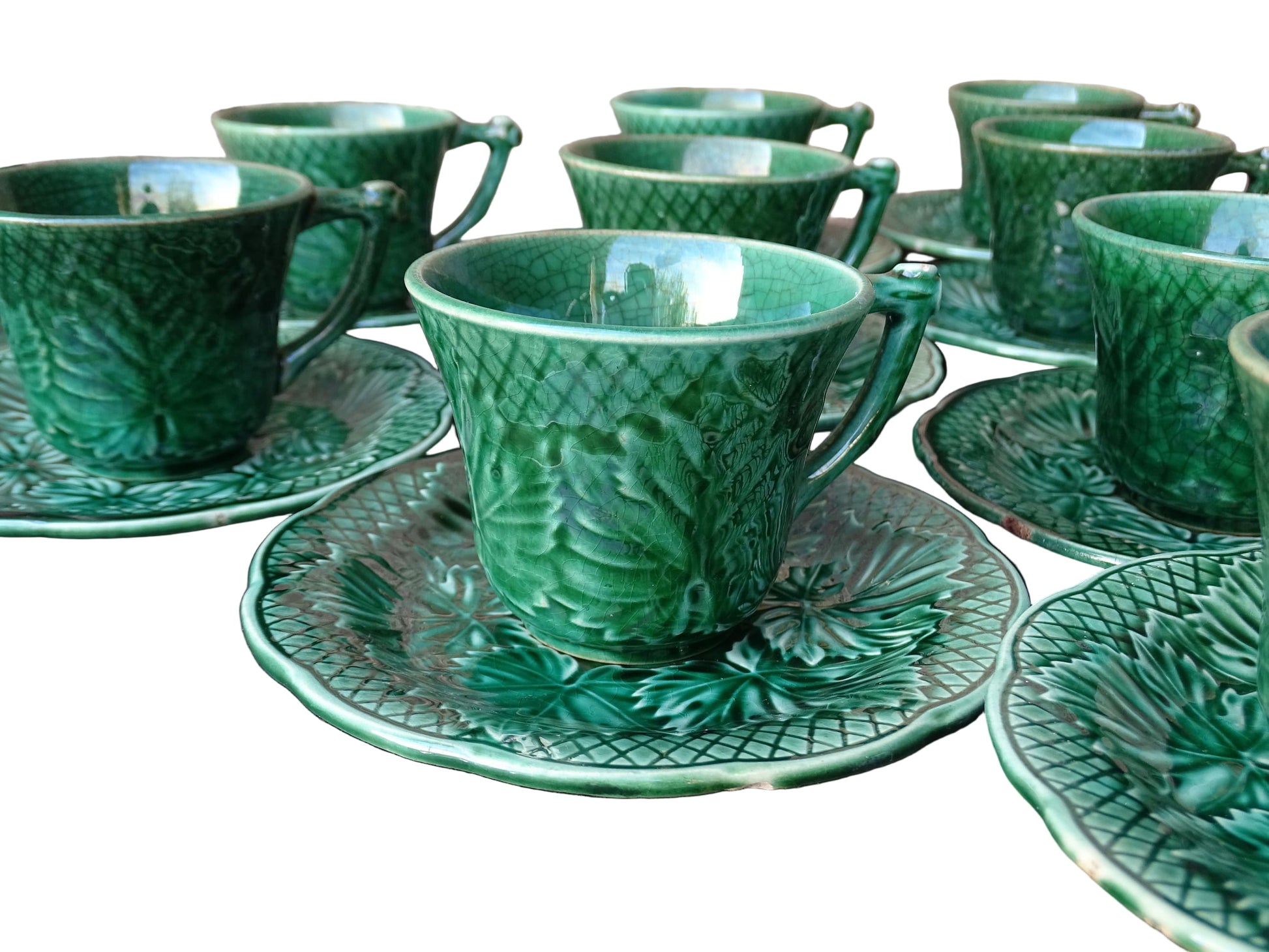 Set of 10 vintage coffee cups by Gien in the Primefleur design with leaf patterns. Green glazed ceramic cups and saucers. Barbotine or majolica cups. 