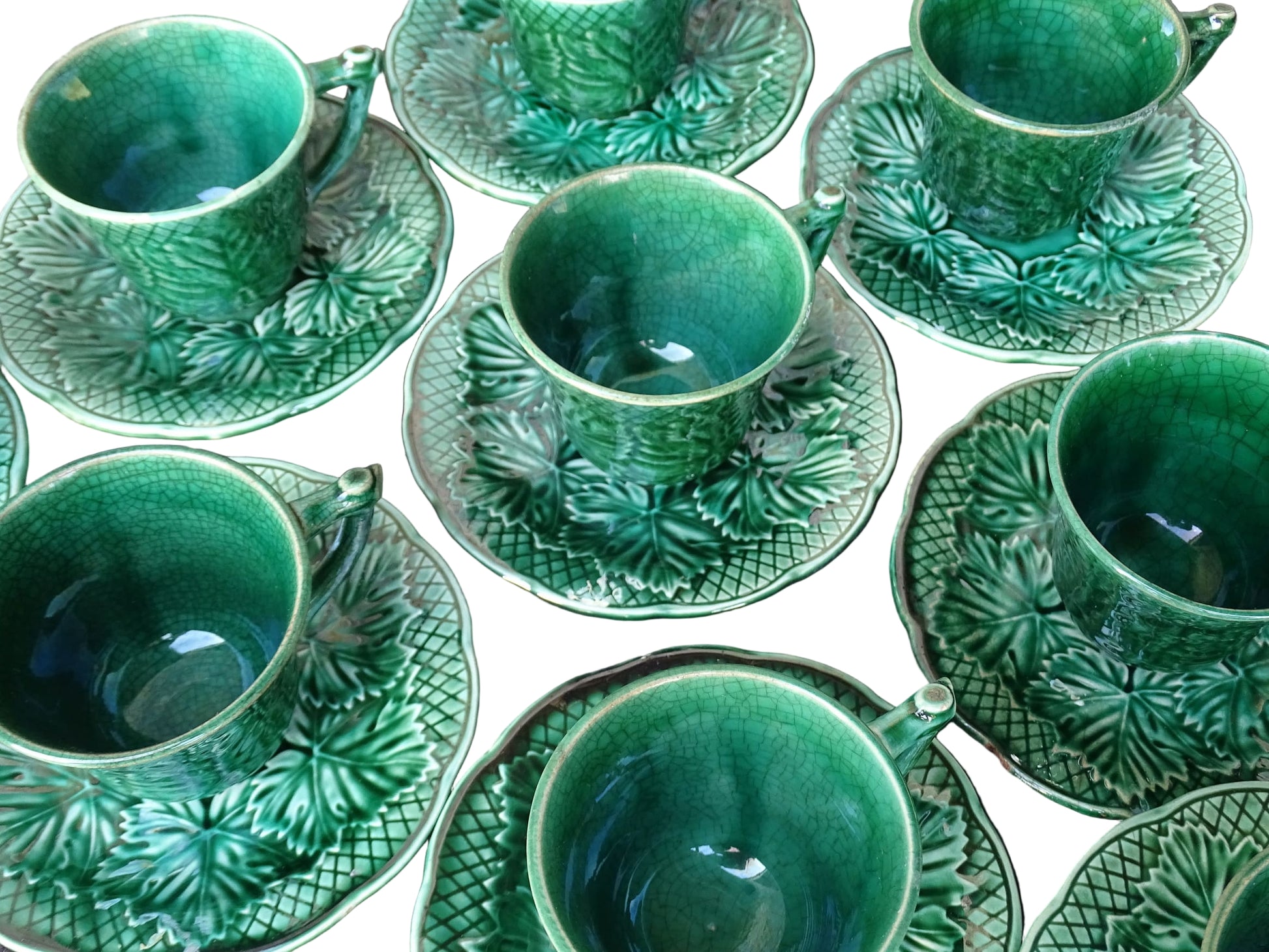 Set of 10 vintage coffee cups by Gien in the Primefleur design with leaf patterns. Green glazed ceramic cups and saucers. Barbotine or majolica cups. 
