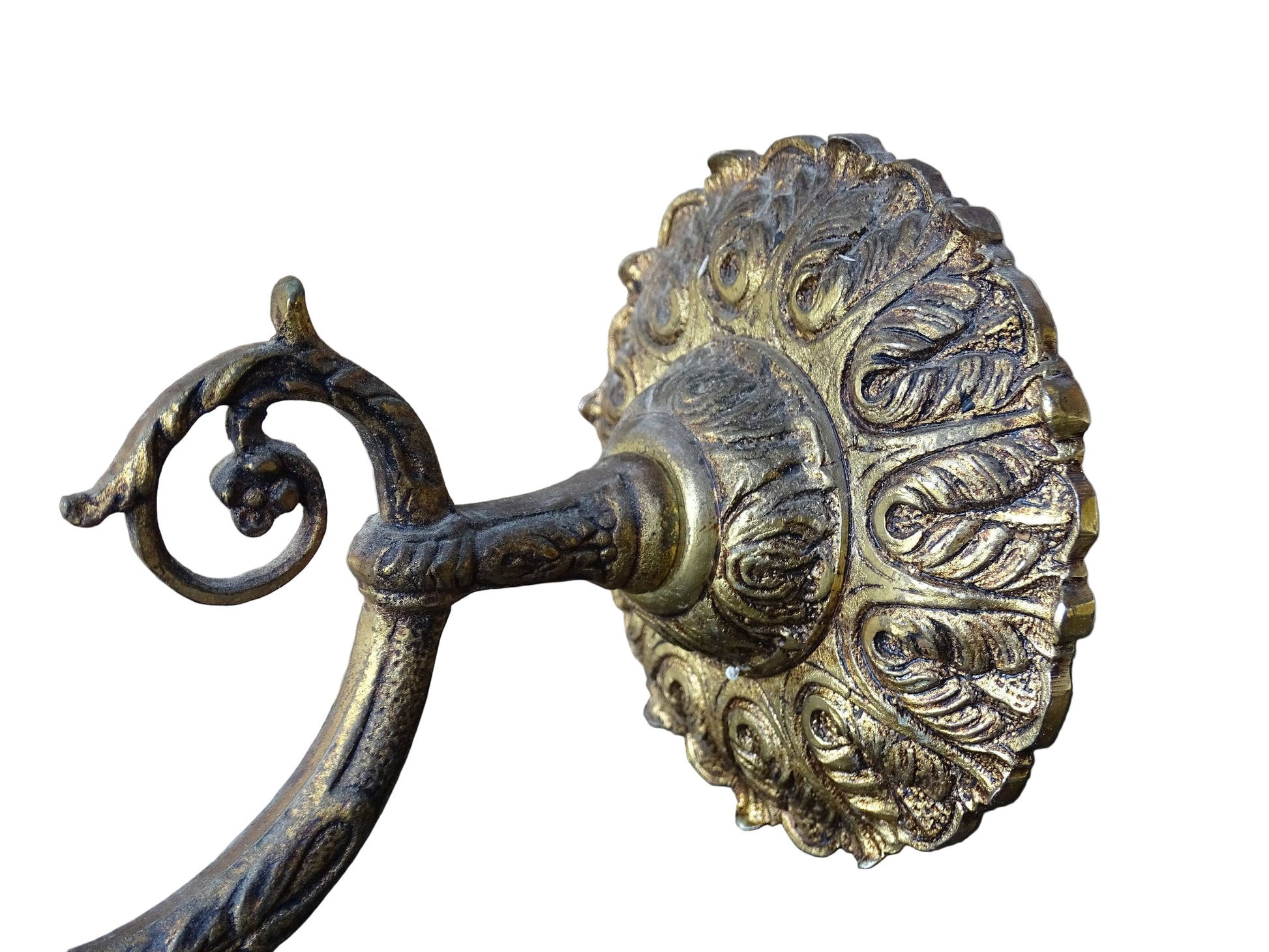 A beautiful French vintage wall light made from gilded metal with a clear cut-glass lantern. The frame has small finials to the top, leaf motifs around the sides, and an ornate scrolling arm. The glass has a diamond pattern.