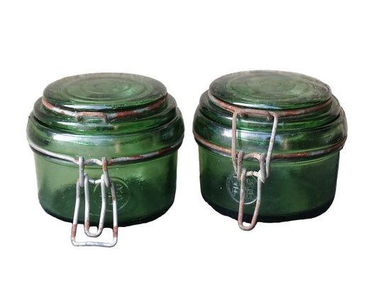Pair of French vintage green glass jars by Dufor with metal fasteners.