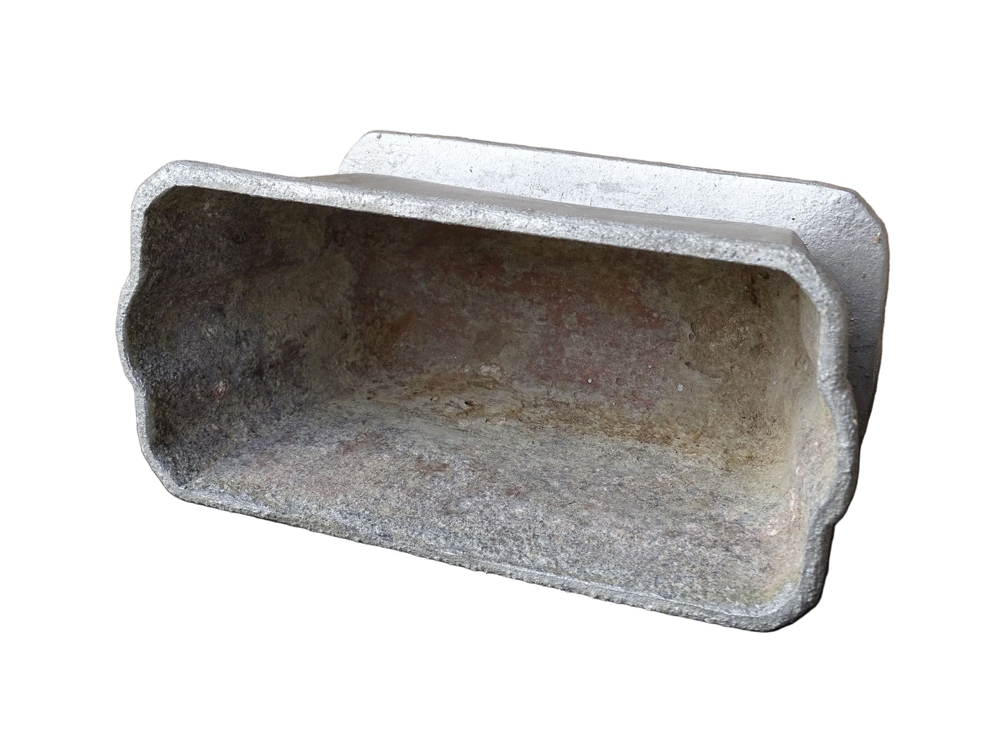 French vintage cast iron planter in silver with a rectangular, flared shape that widens towards the top. It sits on an pedestal-style base. It has a raised geometric border around the upper edge.