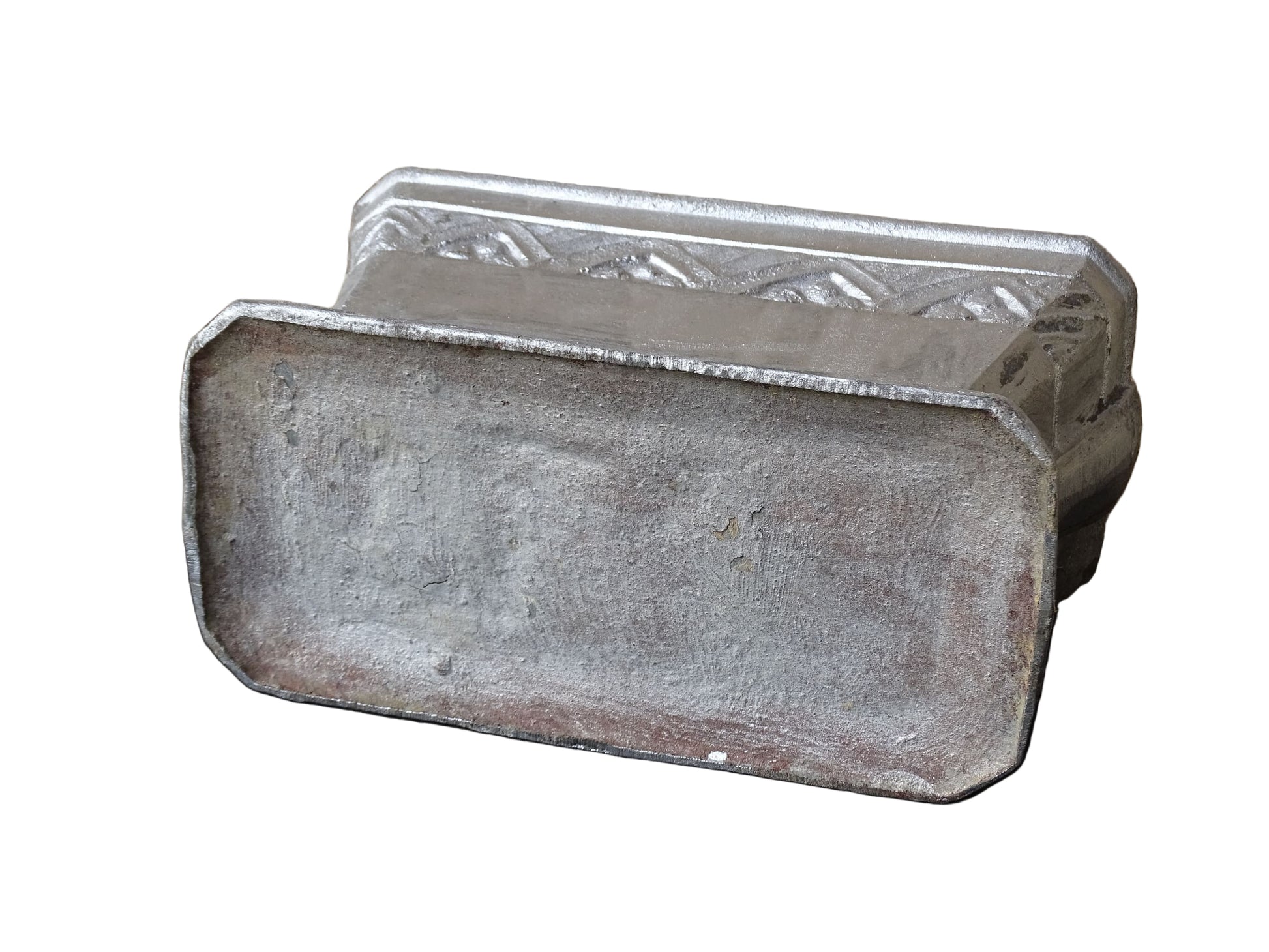 French vintage cast iron planter in silver with a rectangular, flared shape that widens towards the top. It sits on an pedestal-style base. It has a raised geometric border around the upper edge.
