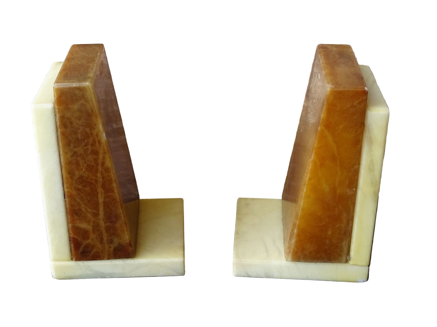 Pair of vintage alabaster bookends with a sculptural look. They have geometric lines with an Art Deco influence. Each bookend has a soft cream alabaster with a warm caramel toned section.