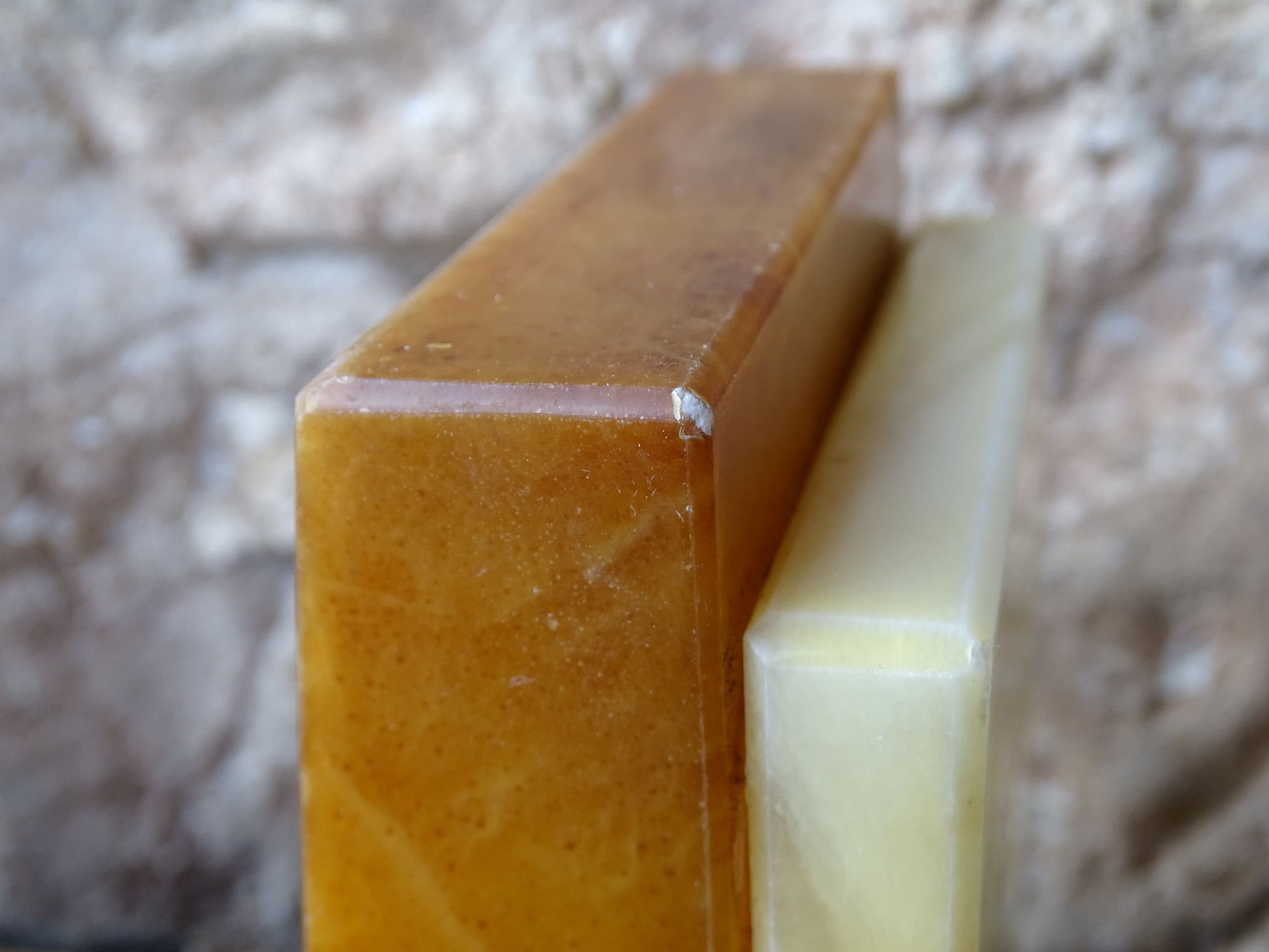 Pair of vintage alabaster bookends with a sculptural look. They have geometric lines with an Art Deco influence. Each bookend has a soft cream alabaster with a warm caramel toned section.