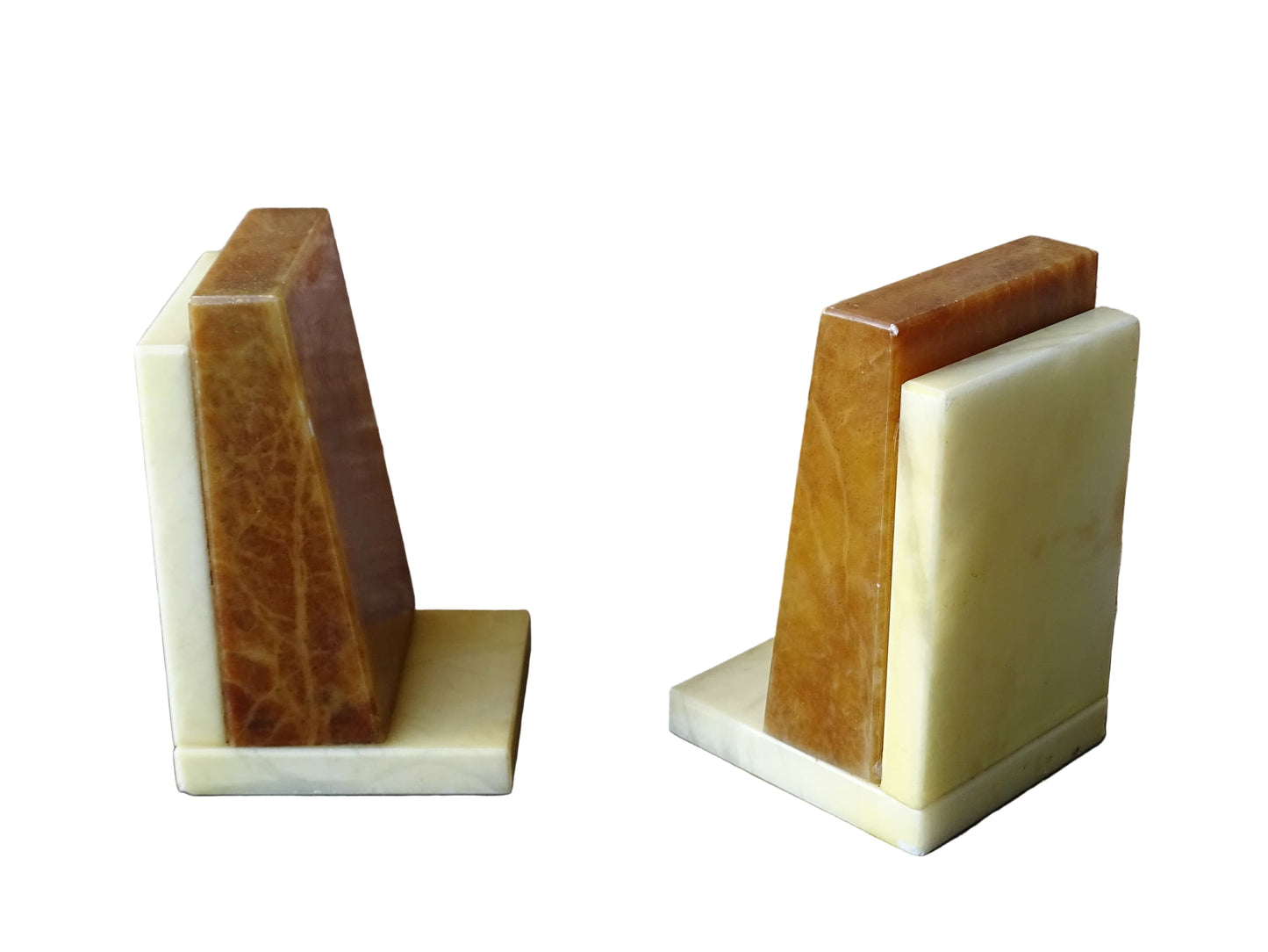 Pair of vintage alabaster bookends with a sculptural look. They have geometric lines with an Art Deco influence. Each bookend has a soft cream alabaster with a warm caramel toned section.