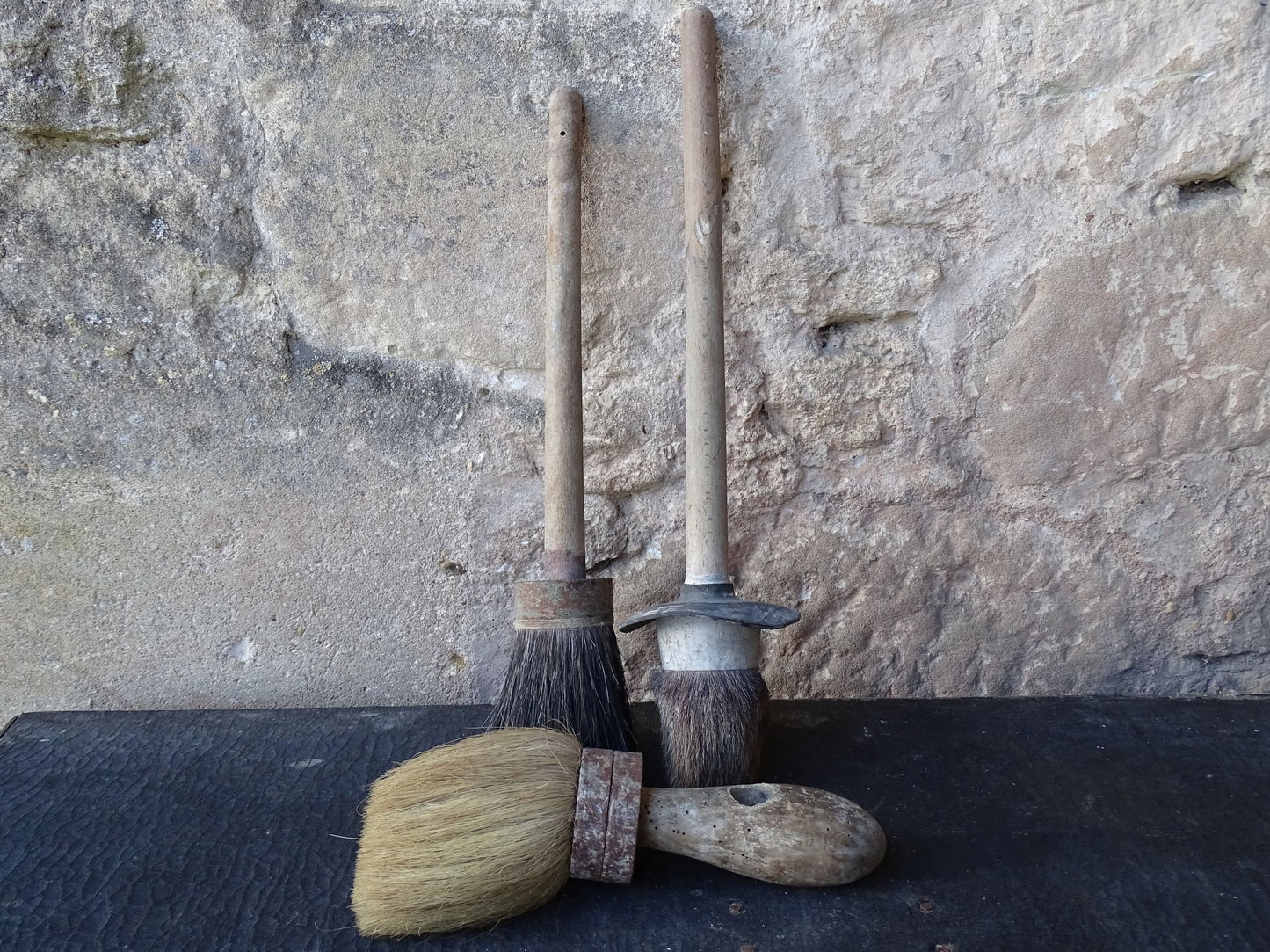 Three old French vintage paint brushes with wooden handles and horse hair brushes.
