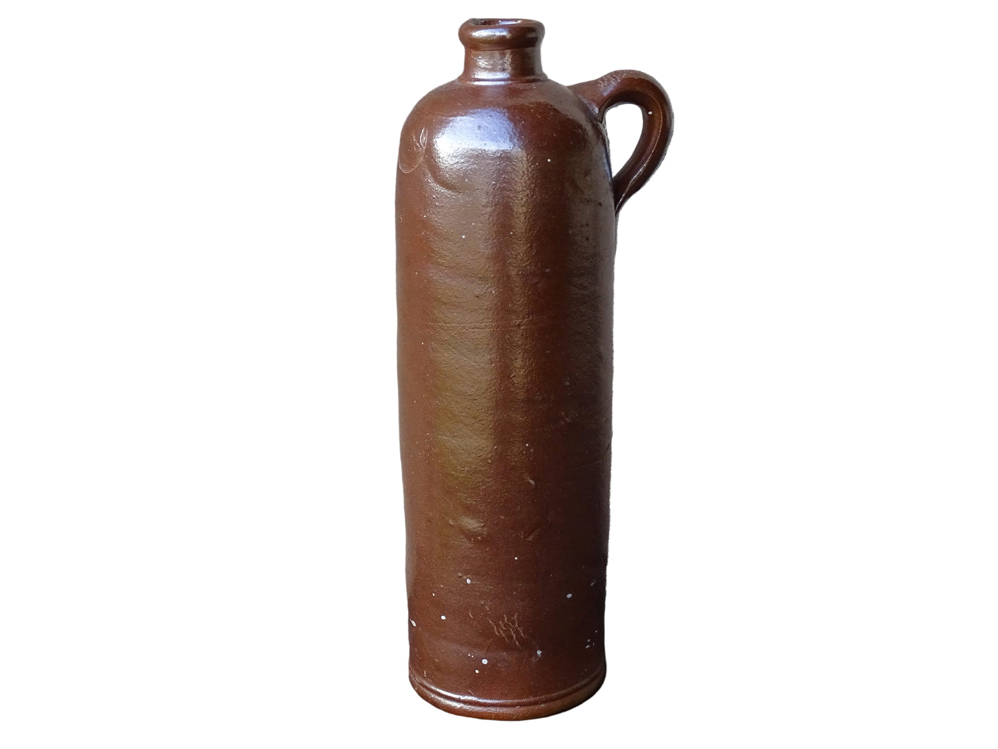 Antique salt glazed stoneware bottle, with a raised lion medallion on the shoulder and a loop handle. Bottle with textured surface and deep brown glaze. 