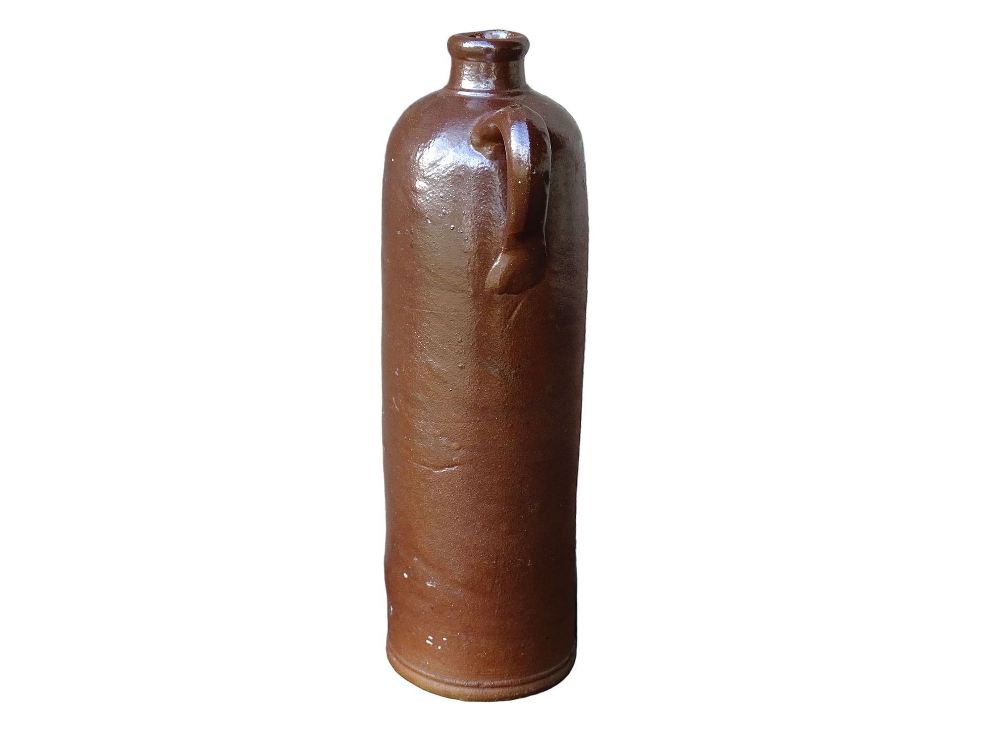 Antique salt glazed stoneware bottle, with a raised lion medallion on the shoulder and a loop handle. Bottle with textured surface and deep brown glaze. 