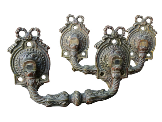 Pair of French antique gilt bronze drawer pulls with ribbon detailing, signed L.Pinet. Nineteenth century ormolu handles. 
