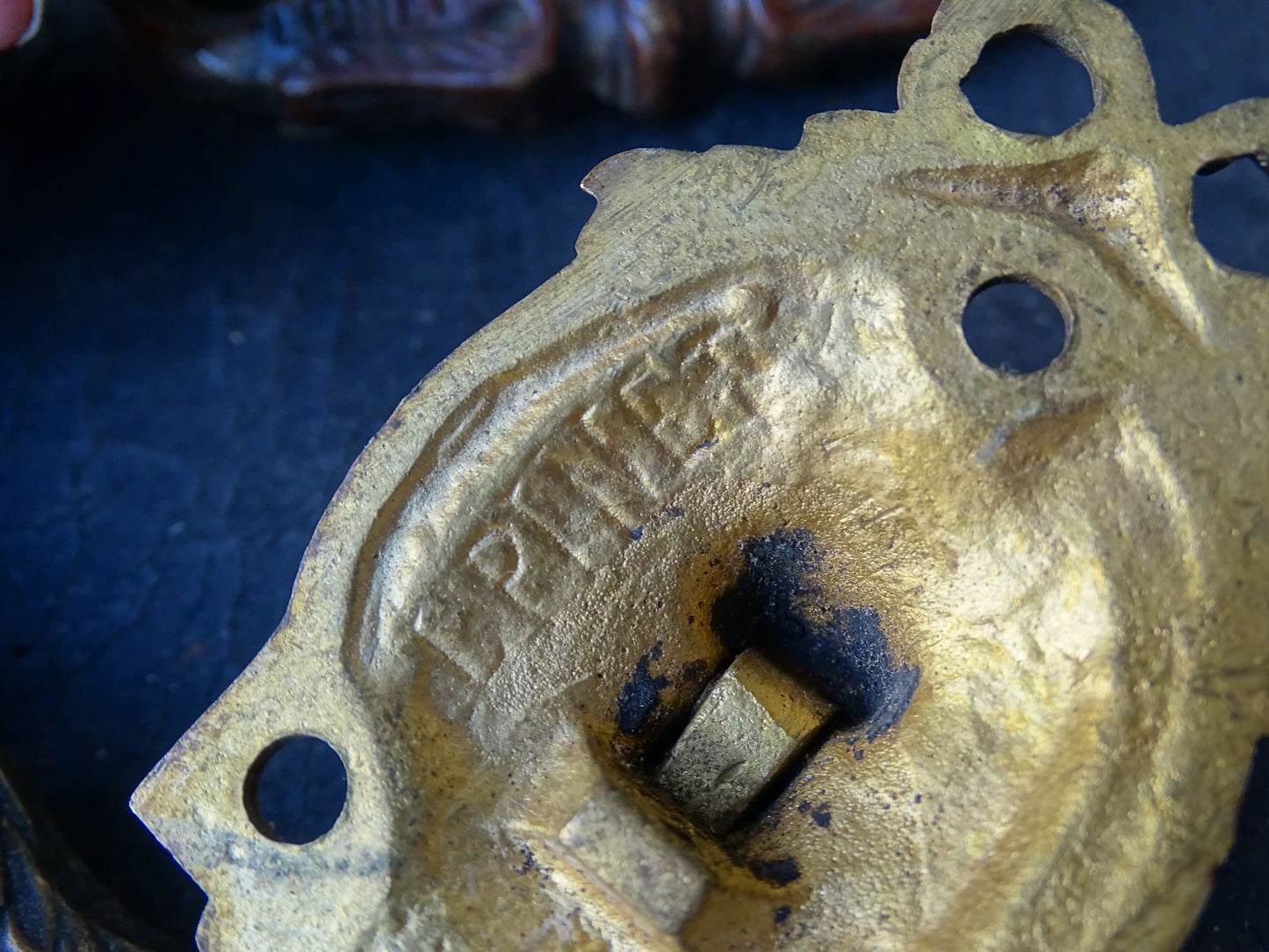 Pair of French antique gilt bronze drawer pulls with ribbon detailing, signed L.Pinet. Nineteenth century ormolu handles. 