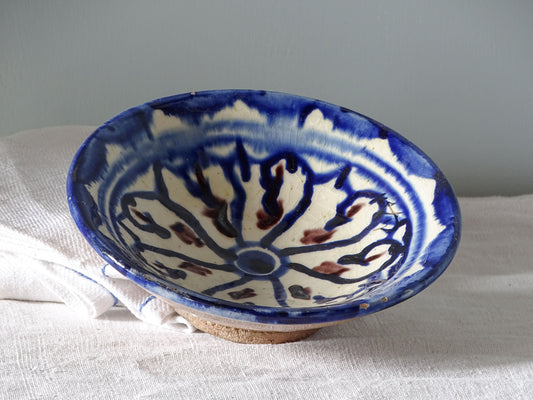 Small vintage moroccan ceramic dish with blue patterned glaze and touches of manganese