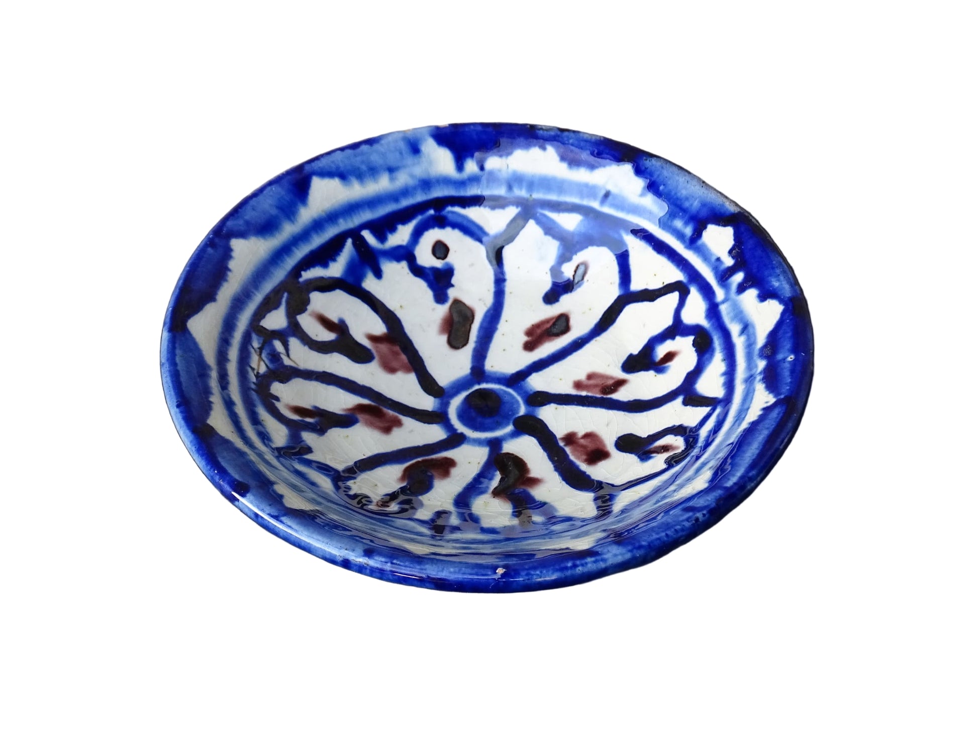 Small vintage ceramic dish with a blue glaze pattern with flecks of red. Moroccan earthenware dish with a hand-painted design.