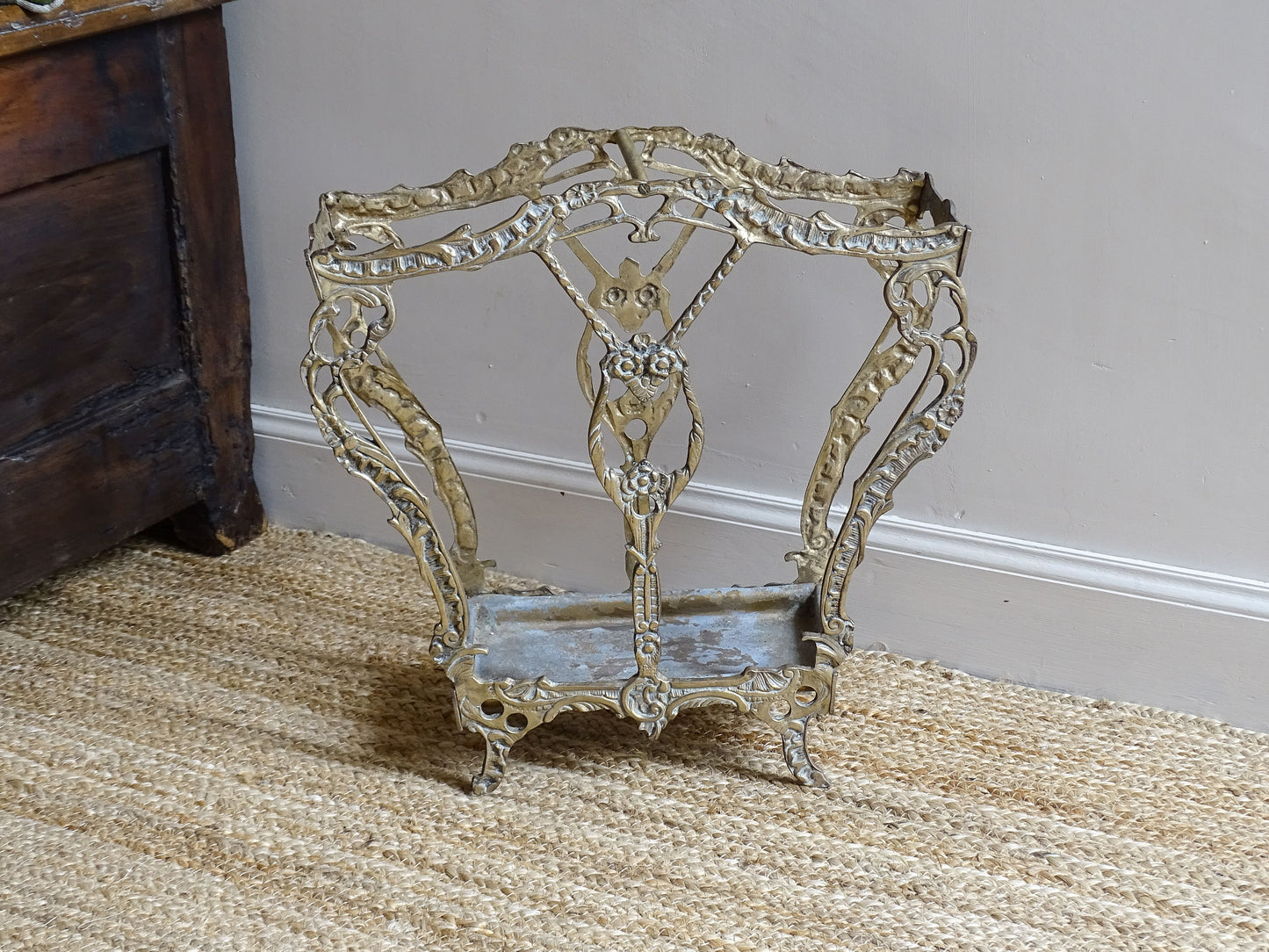French vintage umbrella stand in gold with flower detailing.