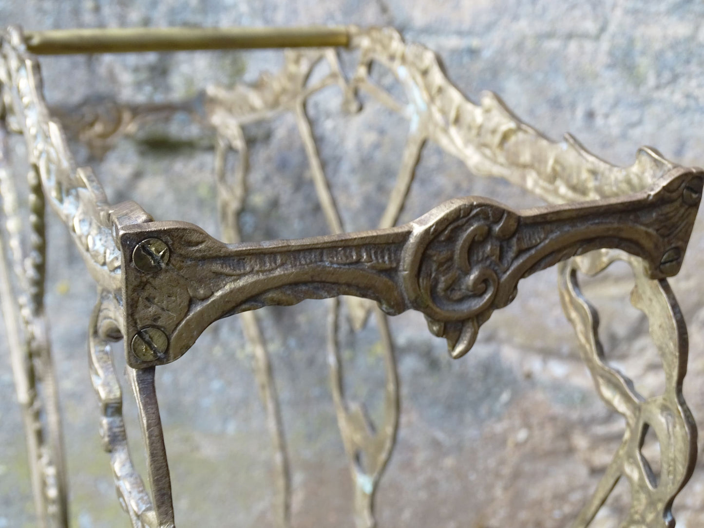 French vintage umbrella stand in gold with flower detailing.
