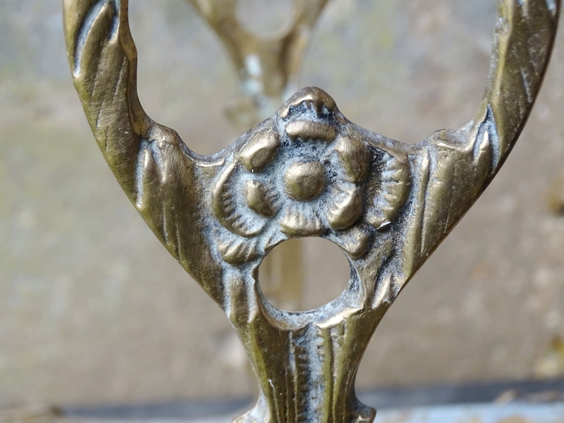French vintage umbrella stand in gold with flower detailing.