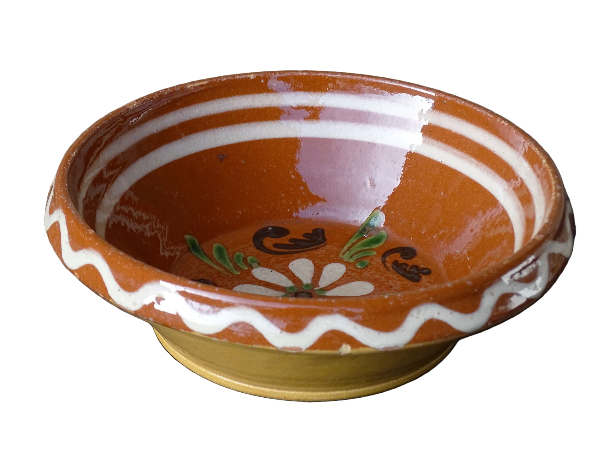 French vintage pottery bowl from Alsace. Glazed terracotta dish with painted flowers.