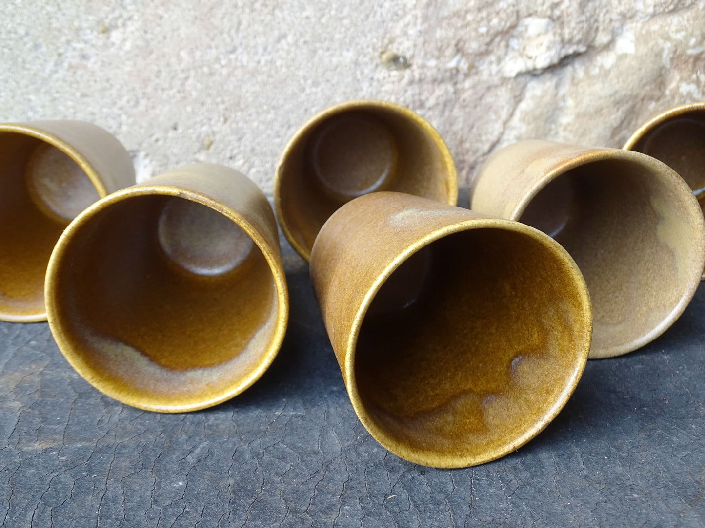 Set of six rustic vintage stoneware cups or pottery tumblers by Digoin in neutral tones. 