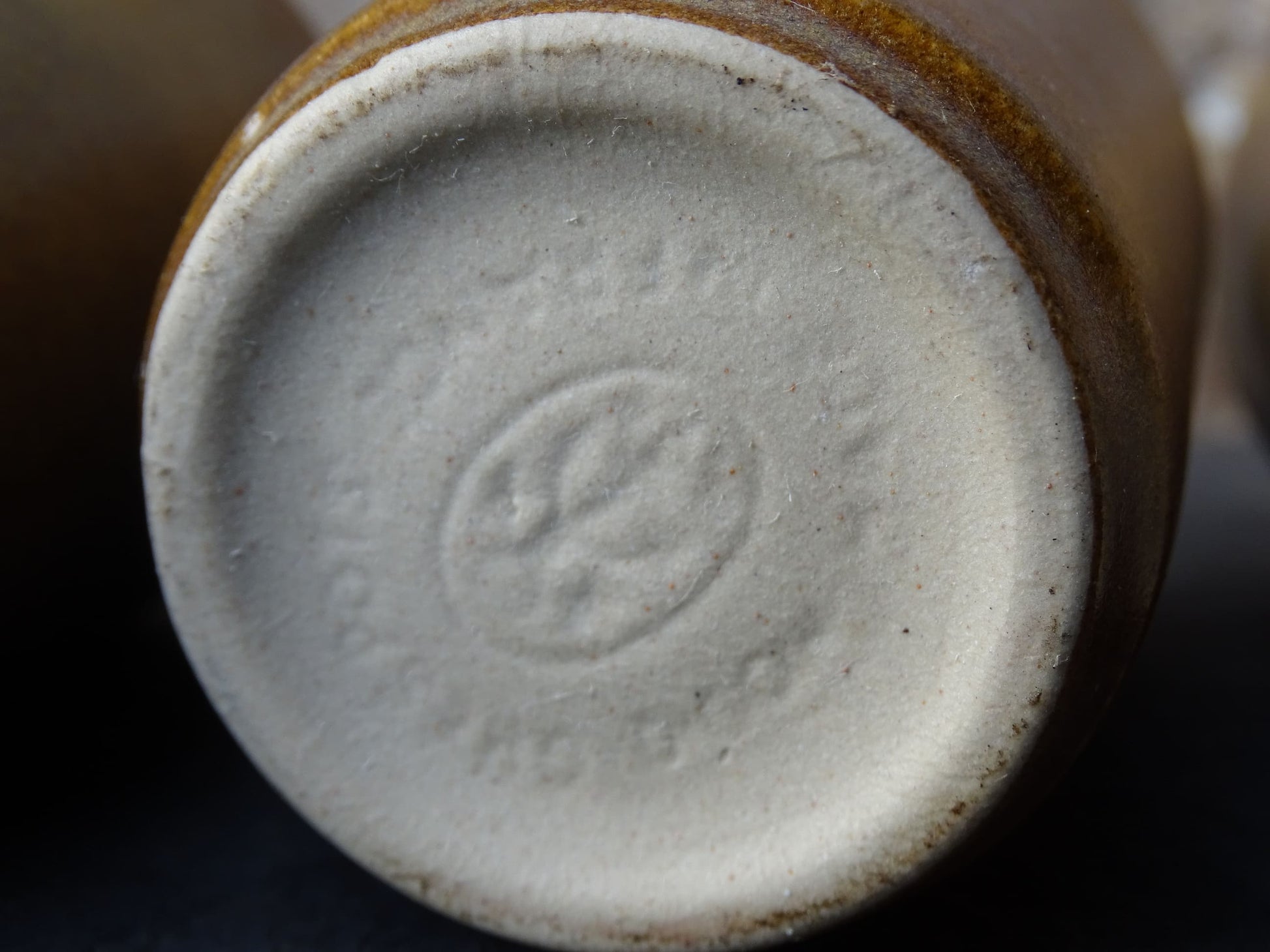 Set of six rustic vintage stoneware cups or pottery tumblers by Digoin in neutral tones. 