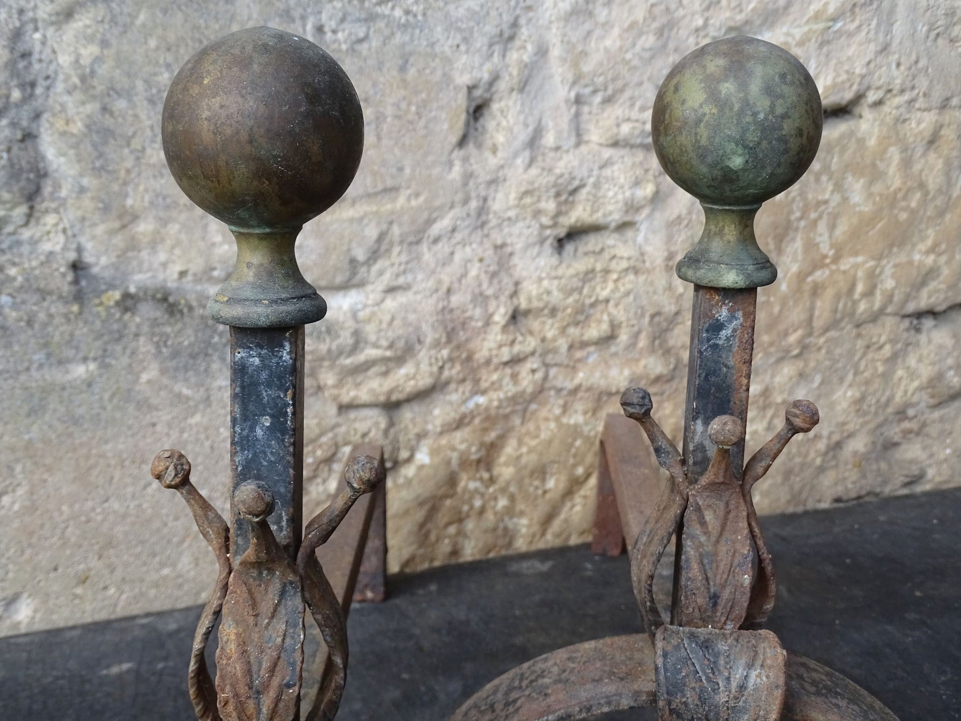 Pair of French antique wrought iron andirons or firedogs with brass finials. 