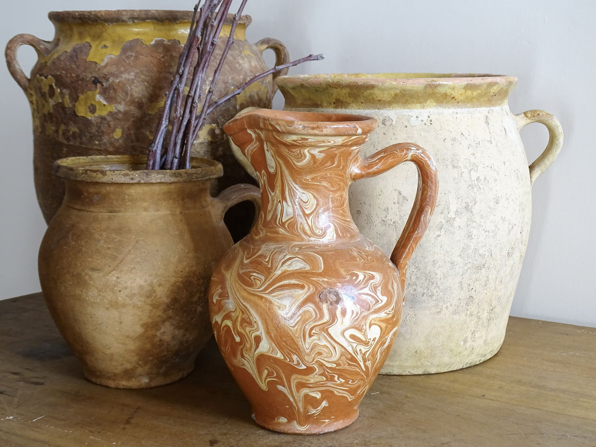 French vintage terracotta pitcher with a marbled glaze. Jaspe glaze ceramic jug. Pictured alongside French antique pottery.