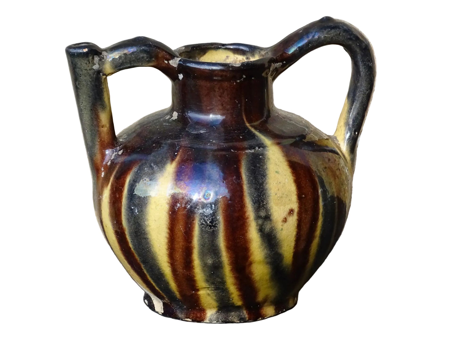 French antique ceramic jug or orjol with striped glaze. Glazed terracotta pitcher with yellow, black and brown glaze. 