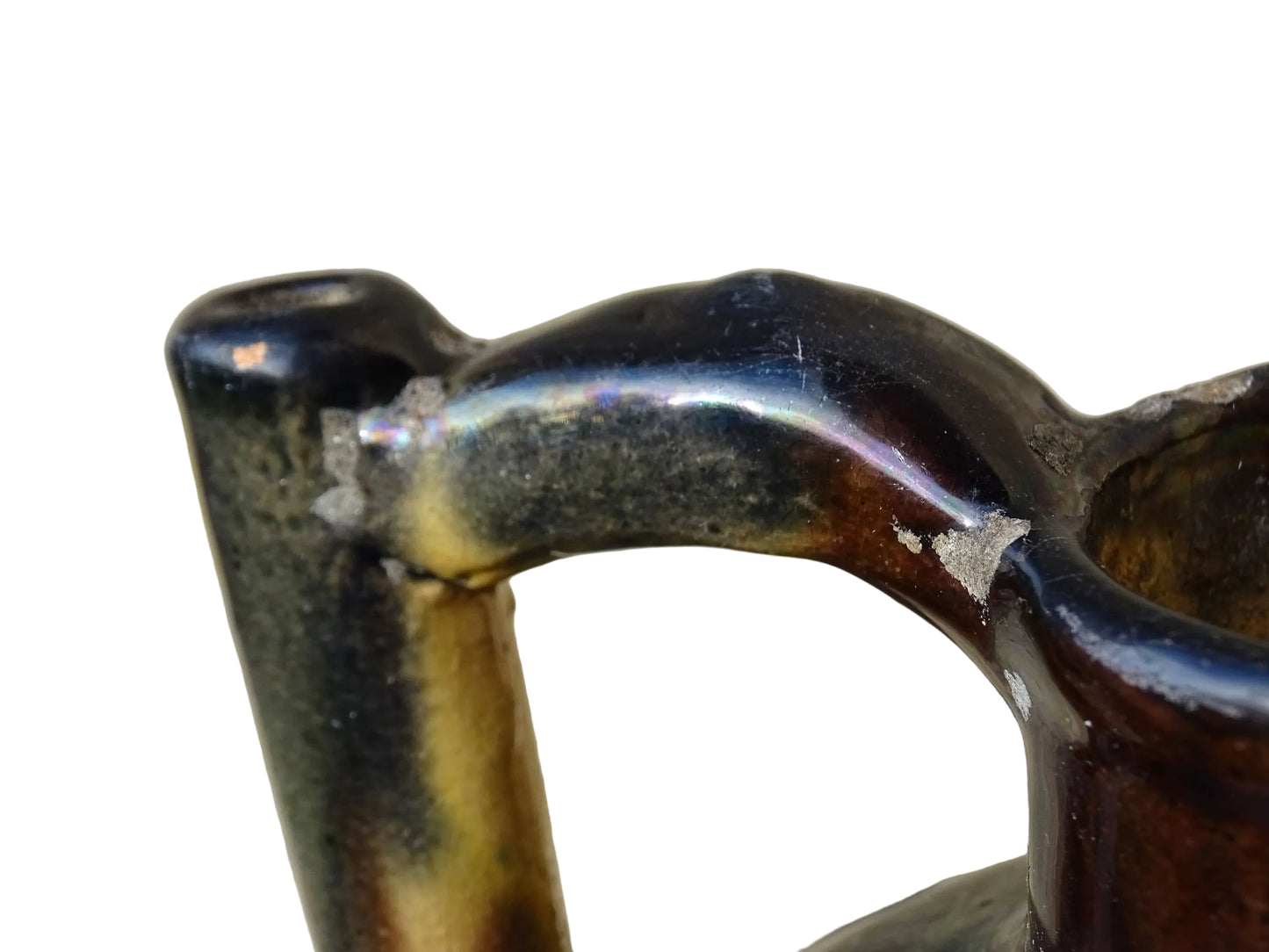 French antique ceramic jug or orjol with striped glaze. Glazed terracotta pitcher with yellow, black and brown glaze. 