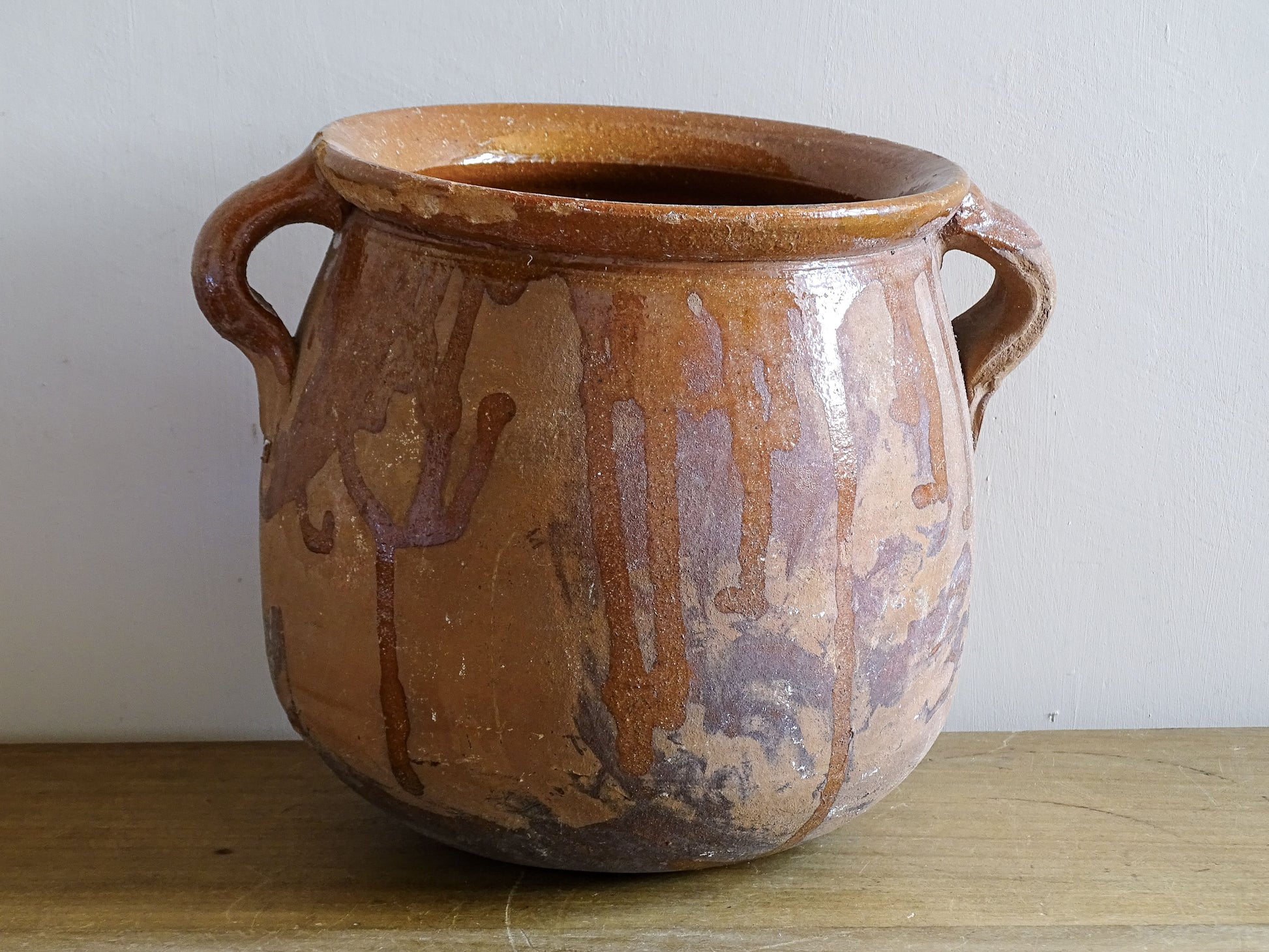 Earthenware vessel with orange glaze