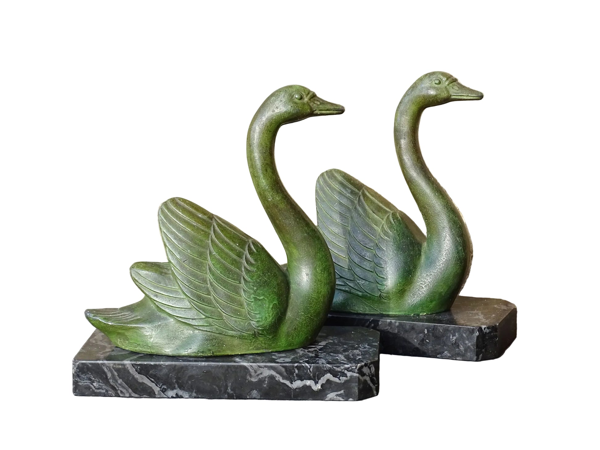 French vintage swan books on black marble bases. The swan statues have a green verdigris effect. 