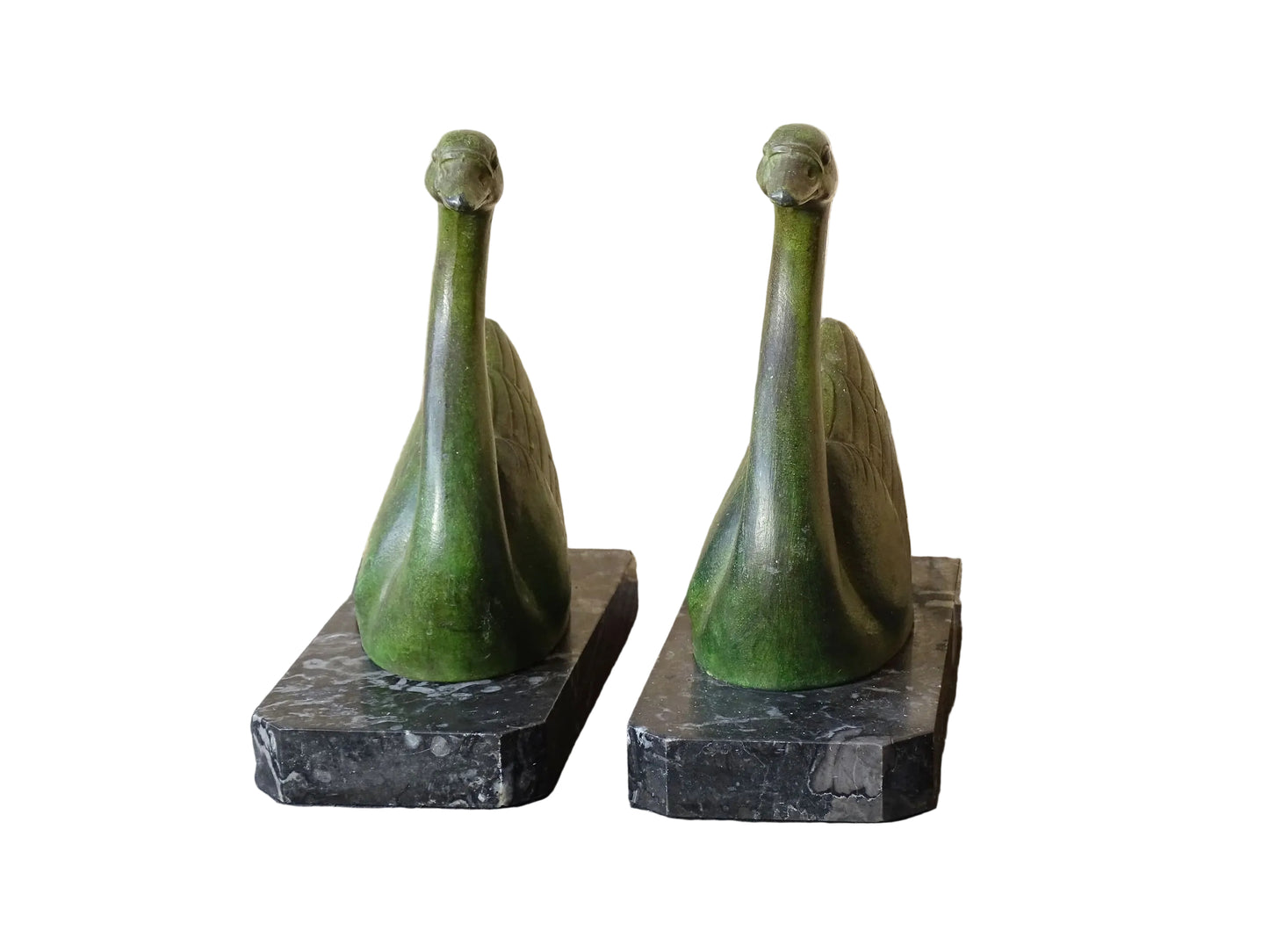 French vintage swan books on black marble bases. The swan statues have a green verdigris effect. 