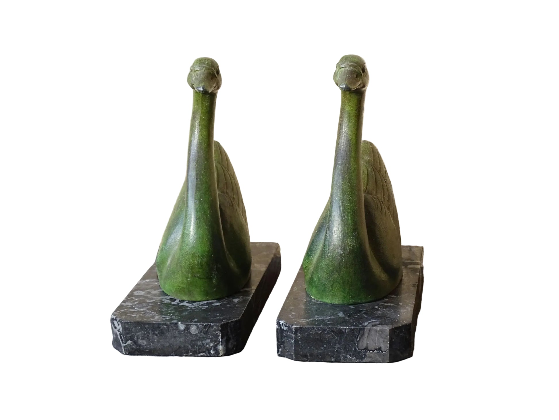 French vintage swan books on black marble bases. The swan statues have a green verdigris effect. 