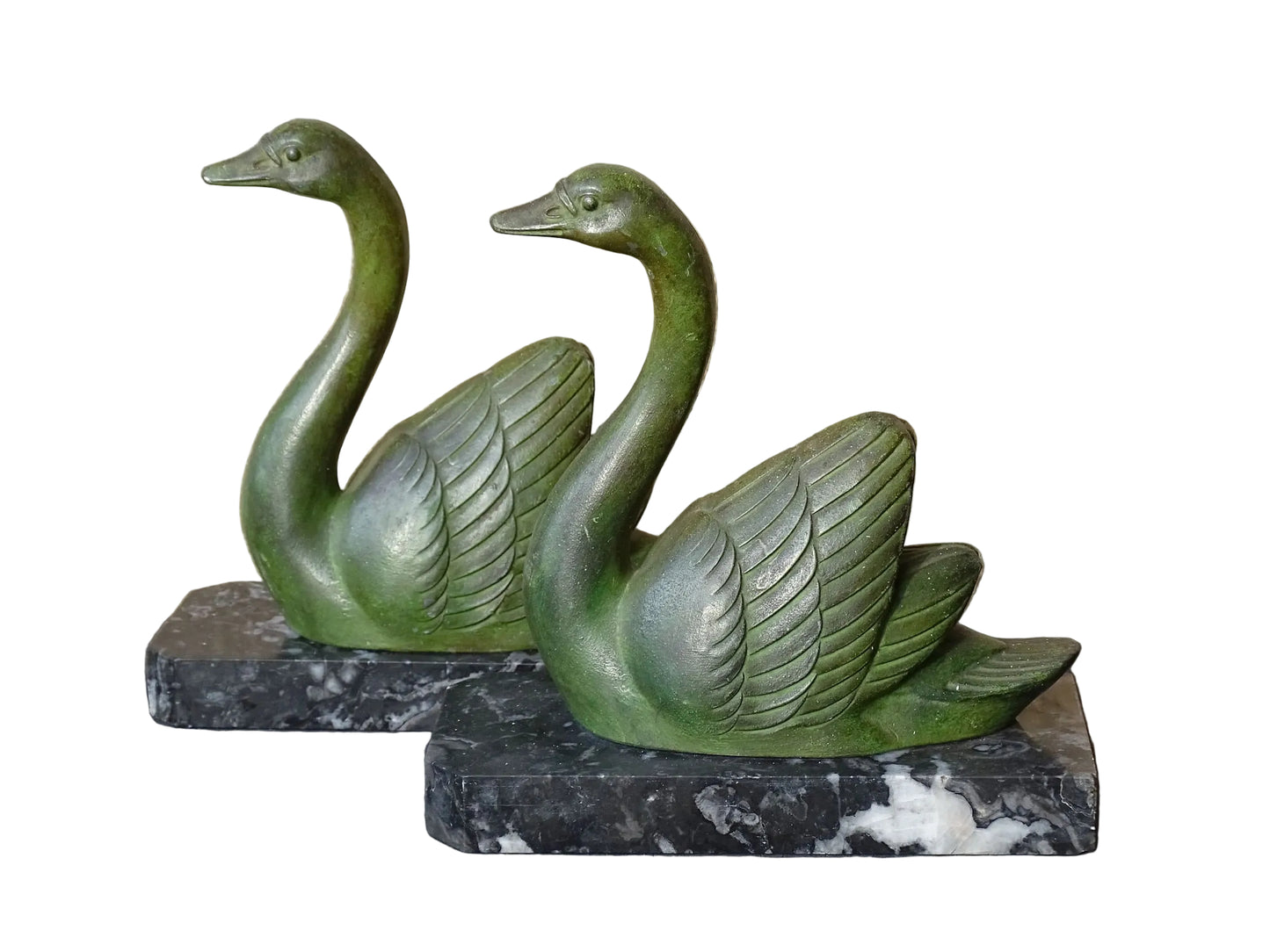 French vintage swan books on black marble bases. The swan statues have a green verdigris effect. 