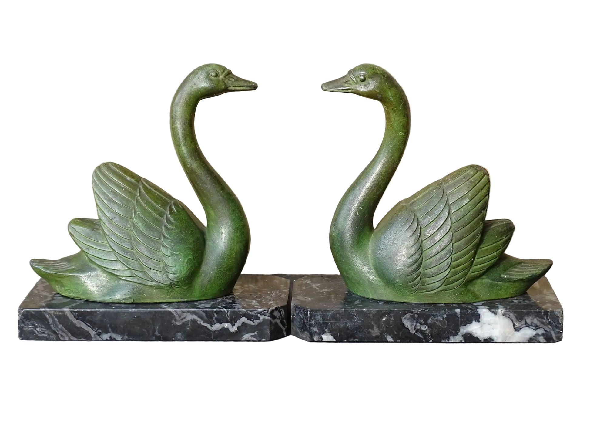 French vintage swan books on black marble bases. The swan statues have a green verdigris effect. 