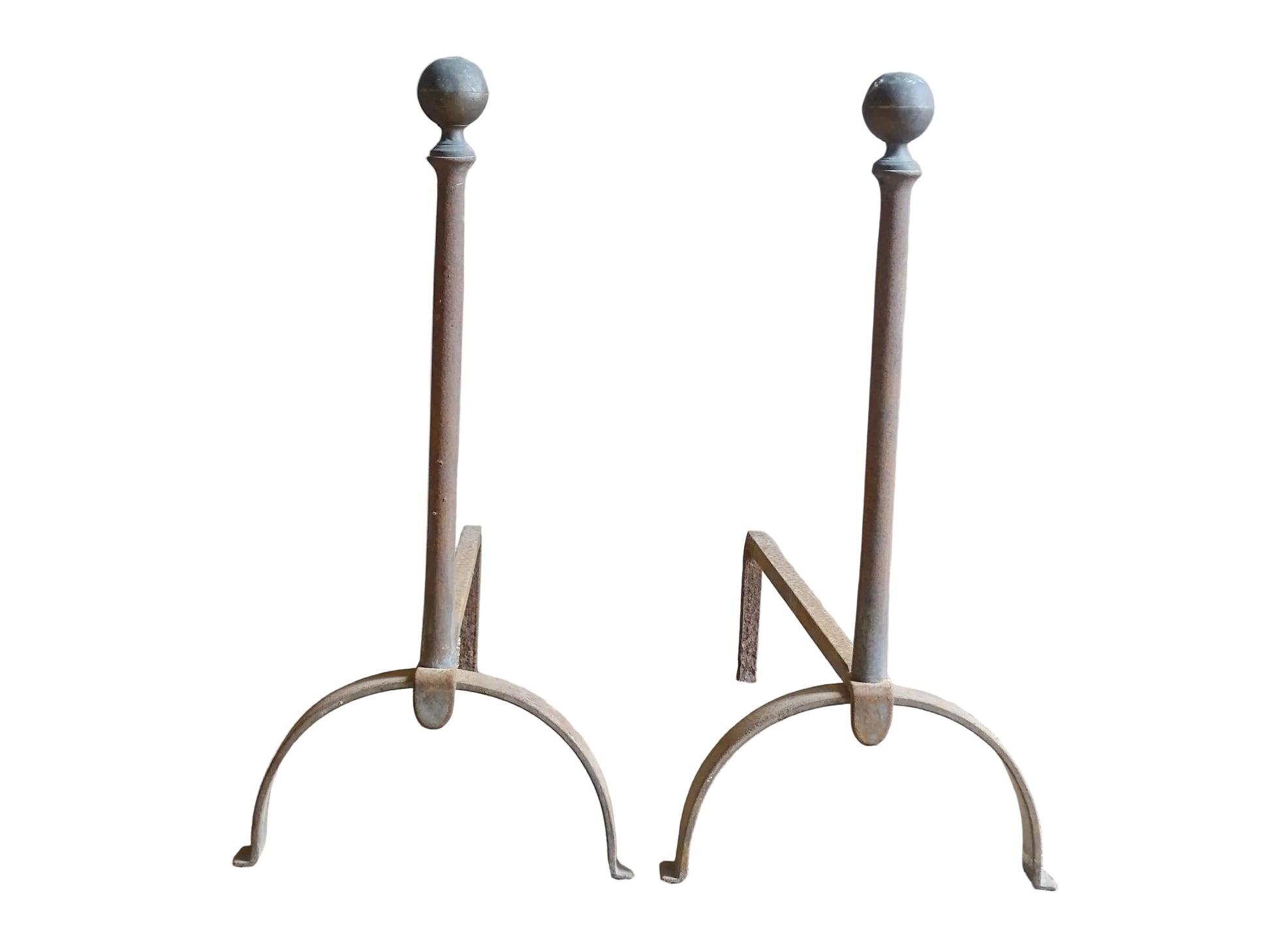 Pair of French antique cast iron andirons or fire dogs, dating to the 19th century. They are rustically aged. These antique fire dogs have globe finials and have beautifully simple farmhouse aesthetic.