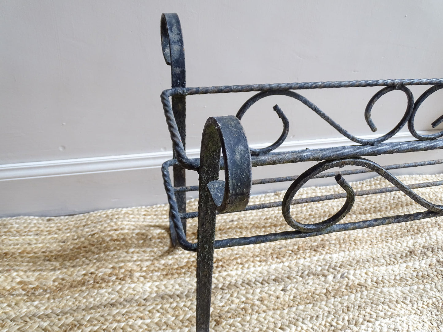 French vintage wrought iron plant stand.  A mid century plant stand, with a  wide central basket and curved detailing. It would make a gorgeous decorative accent both indoors or outdoors.