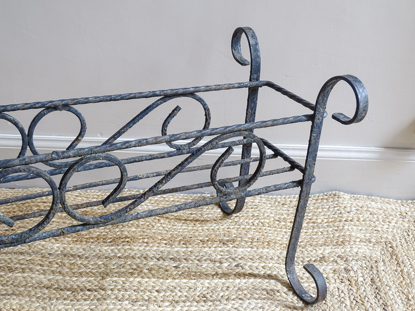 French vintage wrought iron plant stand.  A mid century plant stand, with a  wide central basket and curved detailing. It would make a gorgeous decorative accent both indoors or outdoors.