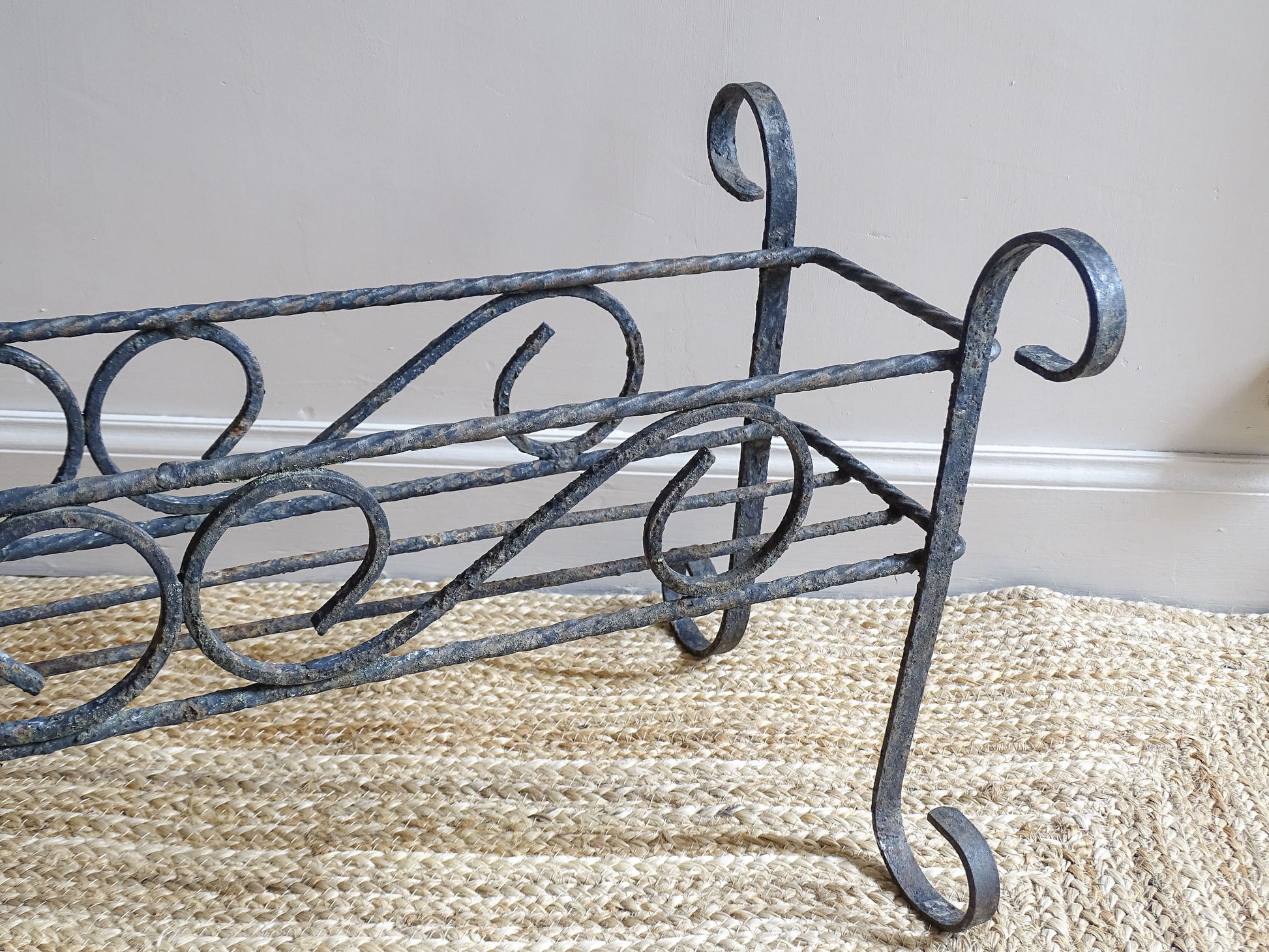 French vintage wrought iron plant stand.  A mid century plant stand, with a  wide central basket and curved detailing. It would make a gorgeous decorative accent both indoors or outdoors.