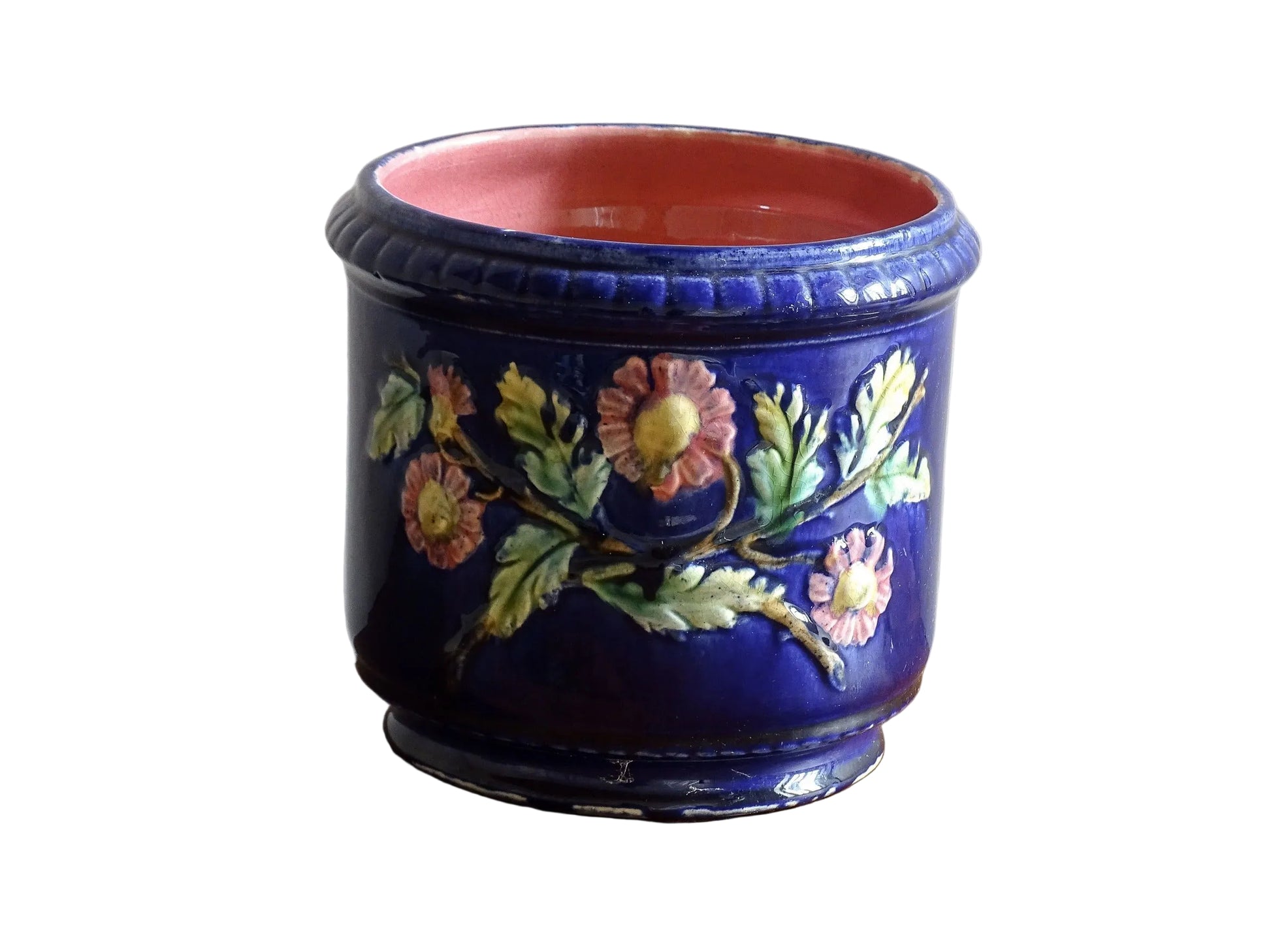 French antique barbotine ceramic planter. A lovely, cobalt blue cache-pot which is beautifully decorated with pink and yellow flowers along with green foliage.