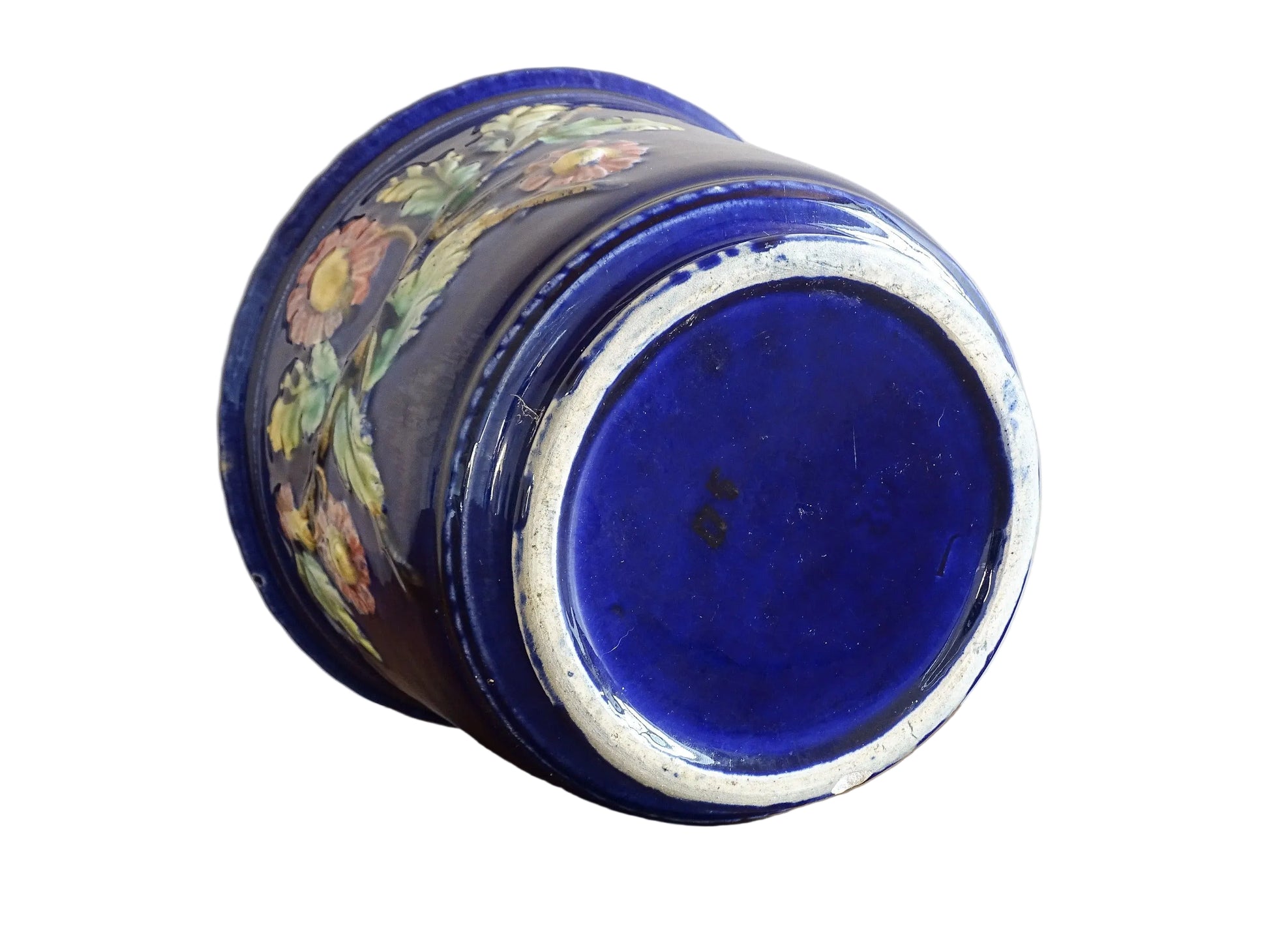 French antique barbotine ceramic planter. A lovely, cobalt blue cache-pot which is beautifully decorated with pink and yellow flowers along with green foliage.