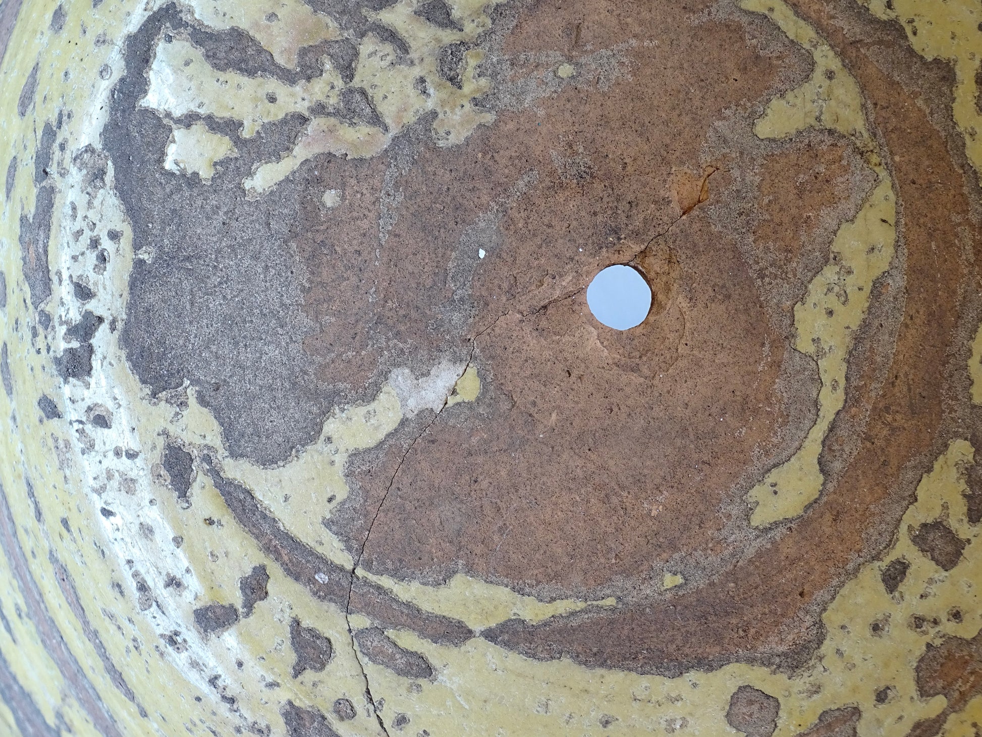 Large antique French confit bowl or gressalle with a yellow glaze to the inside and an unglazed exterior. This terracotta bowl, also known as a tian bowl, has a beautiful patina and originates from South West France. 