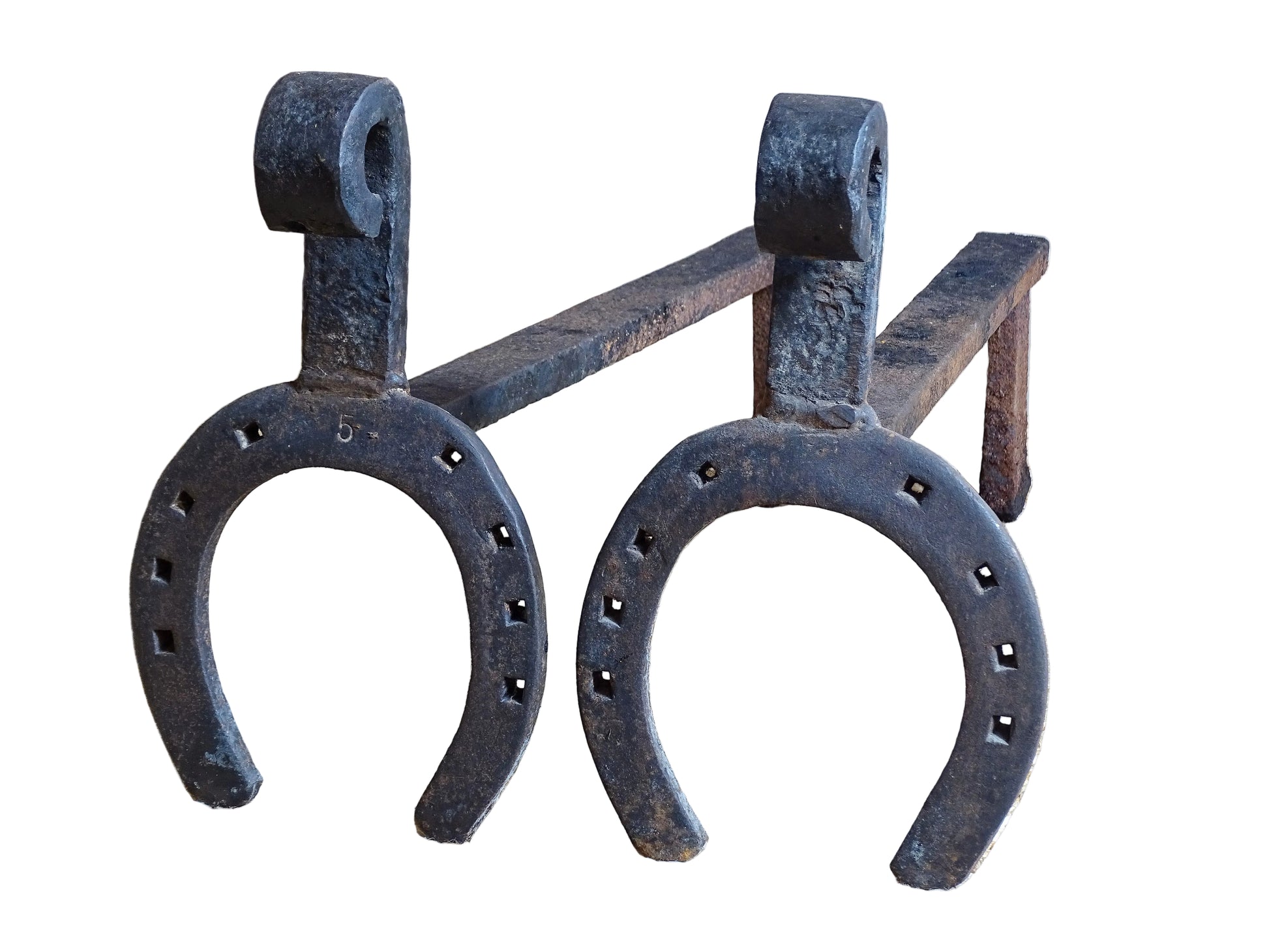  pair of French antique wrought iron andirons or fire dogs, date to the 19th century. They incorporate hand-forged horseshoes, with square-punched nail holes and substantial rear supports. A rustic, agricultural design with authentic forge marks throughout.
