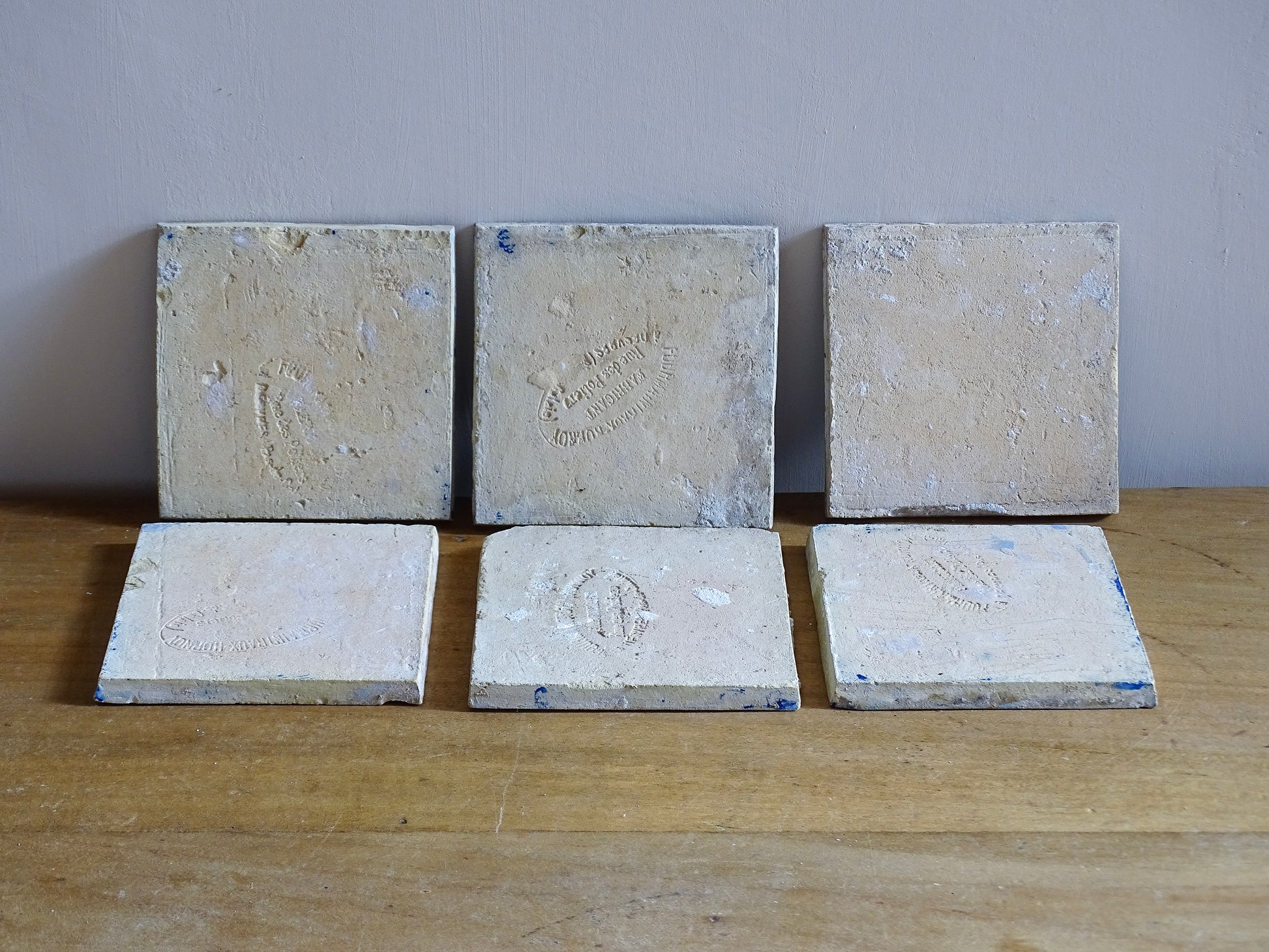 A set of six French antique Desvres faience tiles in blue &amp; white. These transfer printed, earthenware tiles were manufactured in the late 1900's in Desvres, Northern France. Five of the tiles are back-stamped. They are beautiful, transfer printed, architectural blue and white faience tiles with layered cobalt blue cartouche framing.